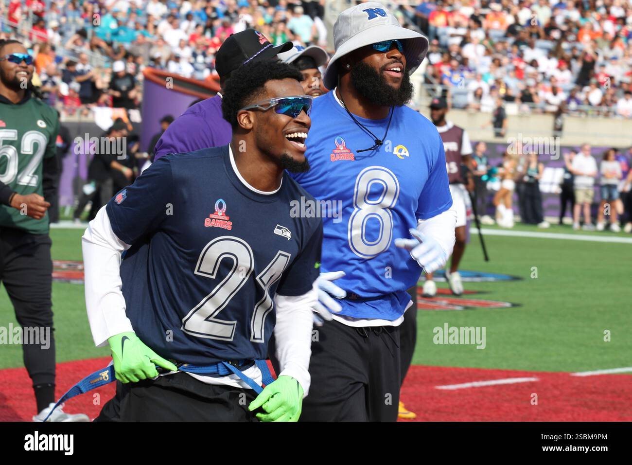 Seattle Seahawks Devon Witherspoon celebrate after a play during the