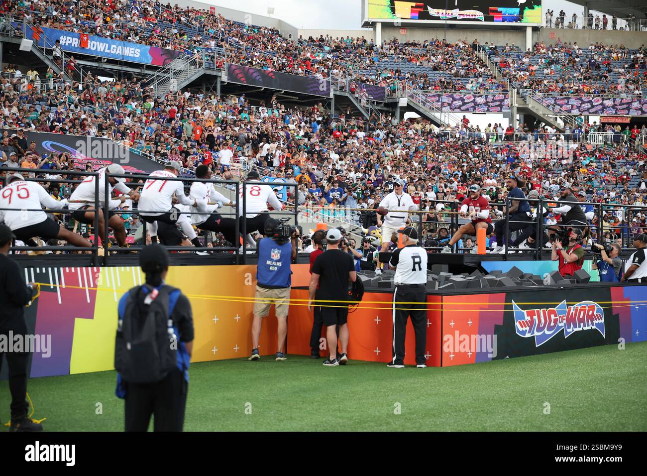 The AFC and NFC battle at tug of war during the NFL Pro Bowl Game on