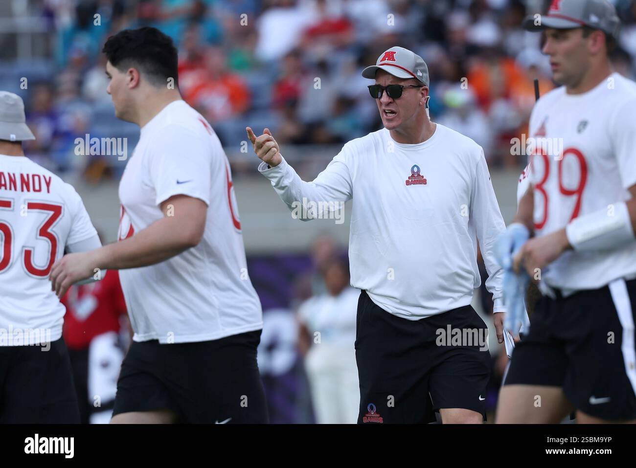 AFC coach Peyton Manning directs players during the NFL Pro Bowl Game