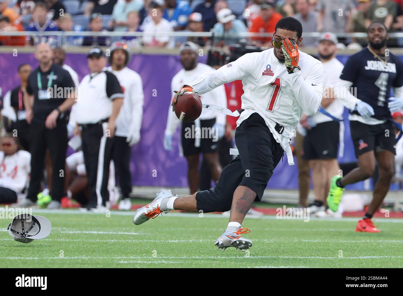 Ja'Marr Chase tries to keep his sunglasses on while running after