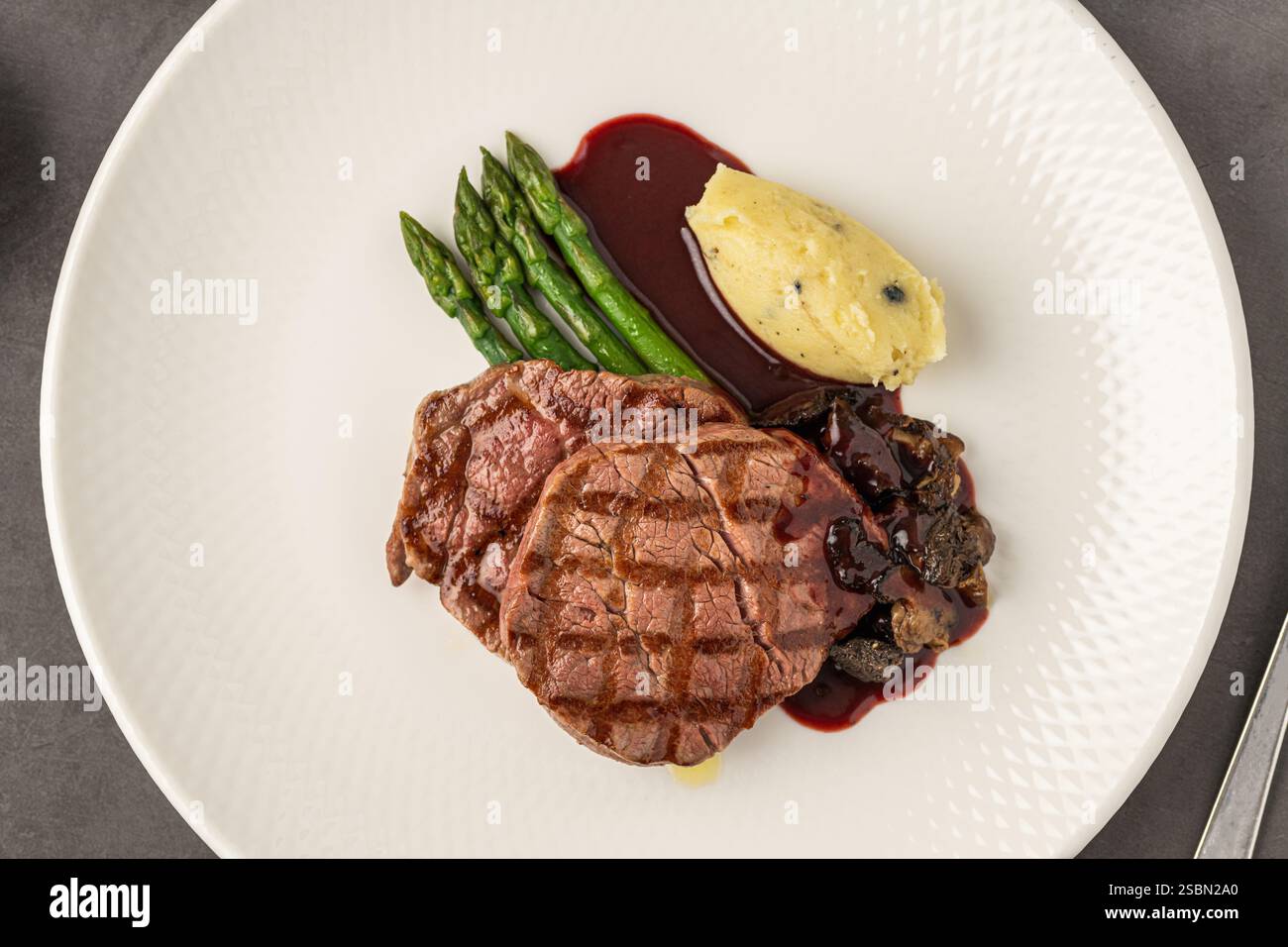 Grilled beef steak with red wine sauce, mashed potatoes, and asparagus ...