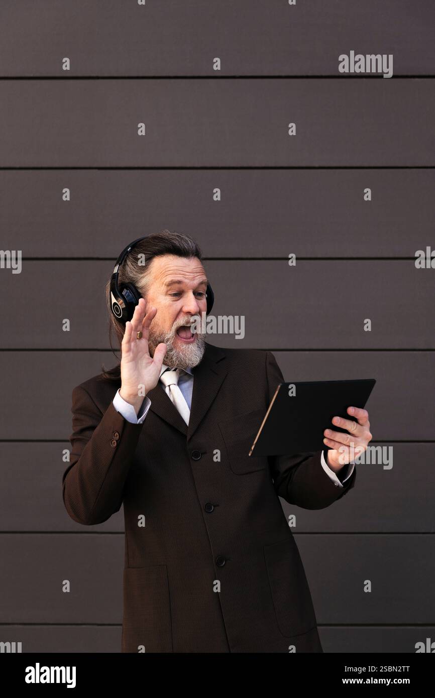 mature man using tablet for an online video call Stock Photo