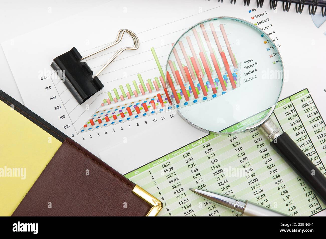 Graphs tables and documents laid on the table Stock Photo