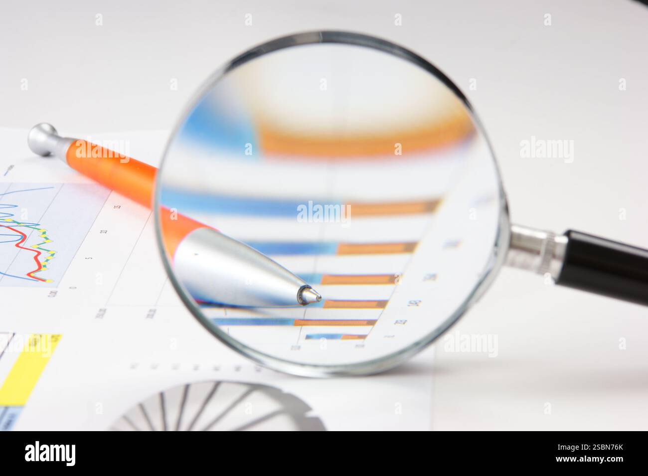 Graphs tables and documents laid on the table Stock Photo