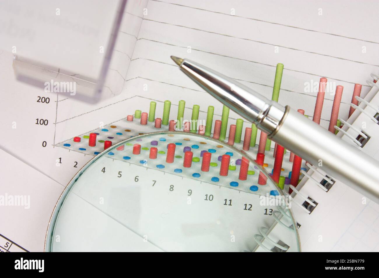 Graphs tables and documents laid on the table Stock Photo