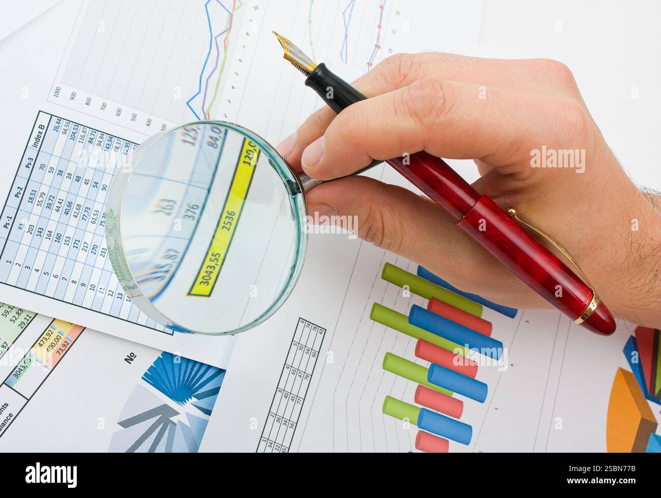 Graphs tables and documents laid on the table Stock Photo