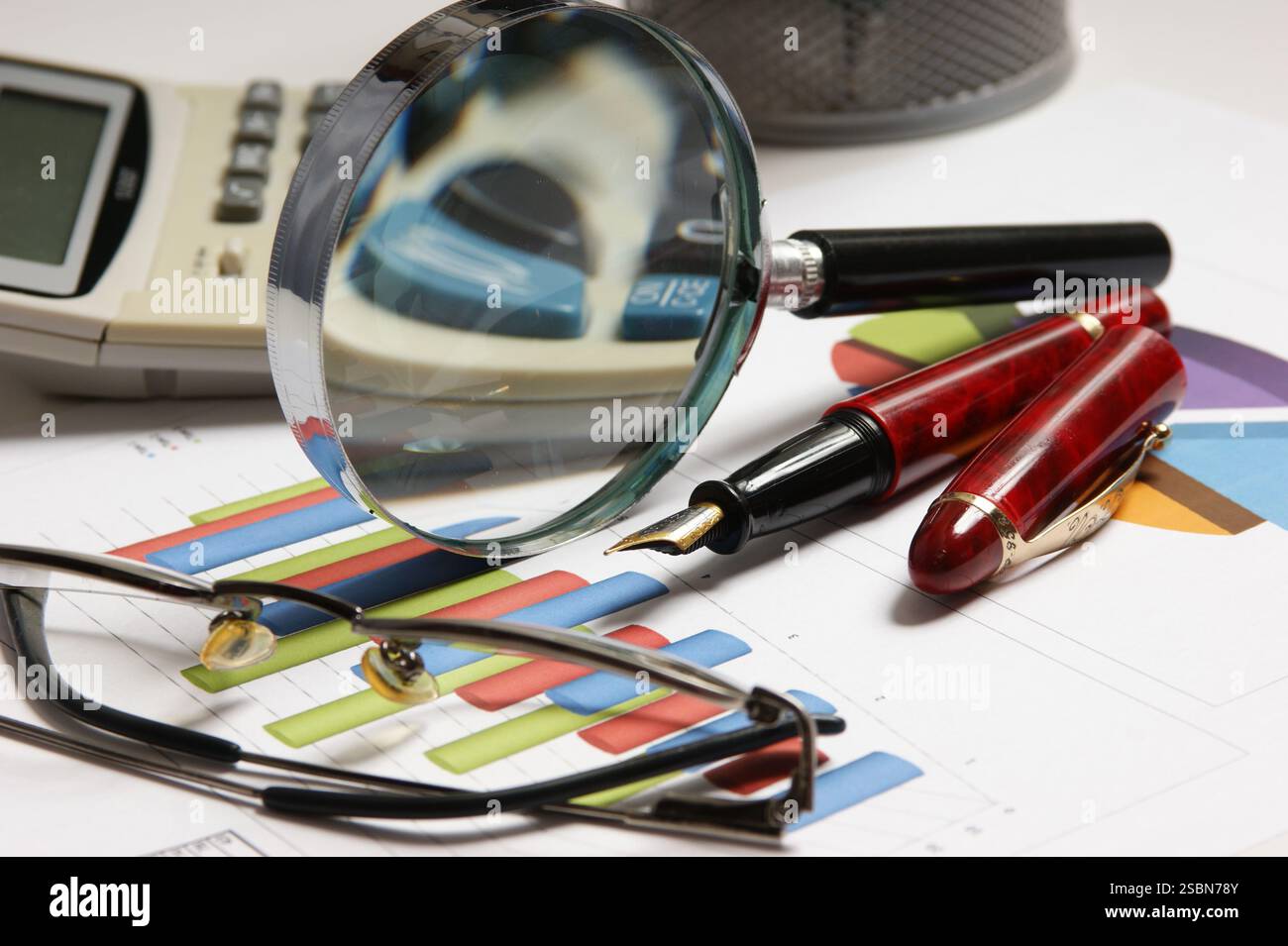Graphs tables and documents laid on the table Stock Photo