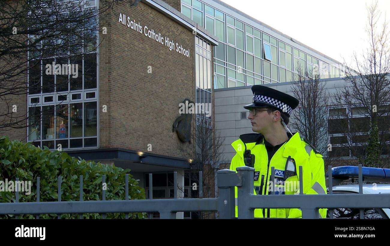 Police officers outside All Saints Catholic High School, on Granville