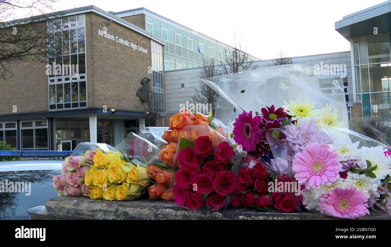 Floral tributes left outside All Saints Catholic High School, on