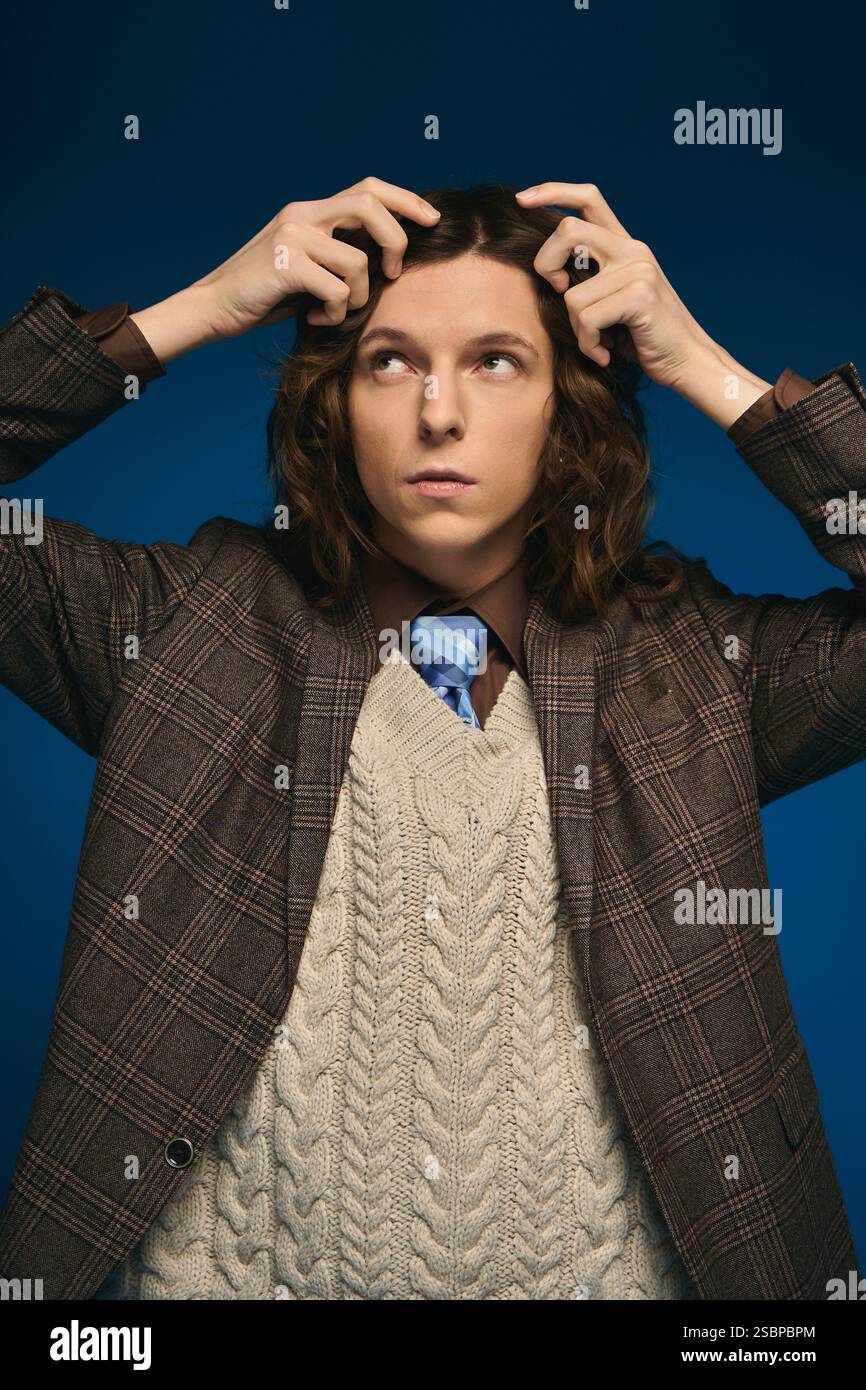 A handsome young man in a fashionable outfit exudes confidence while ...