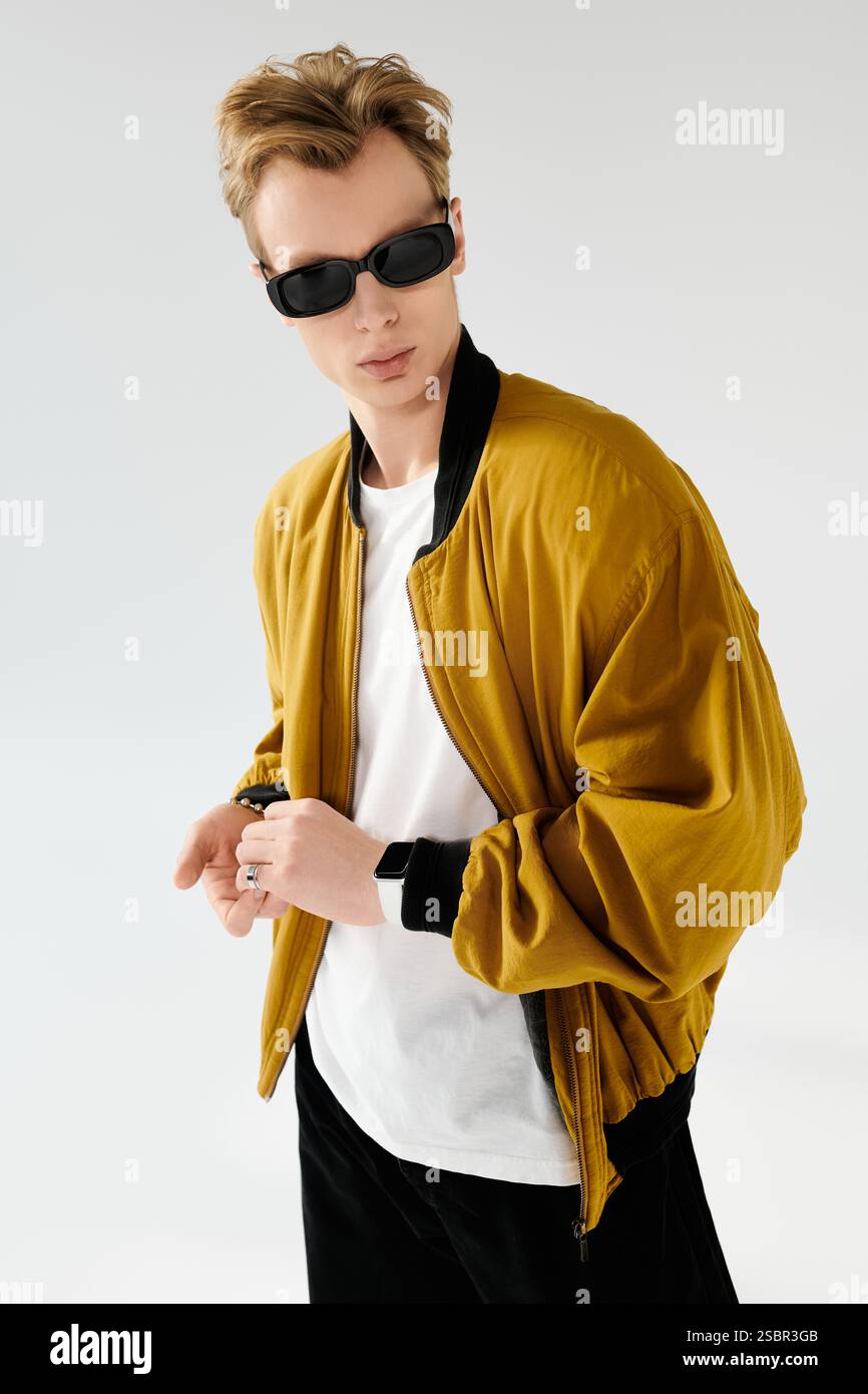 A handsome young man confidently displays his fashion sense with a bold ...