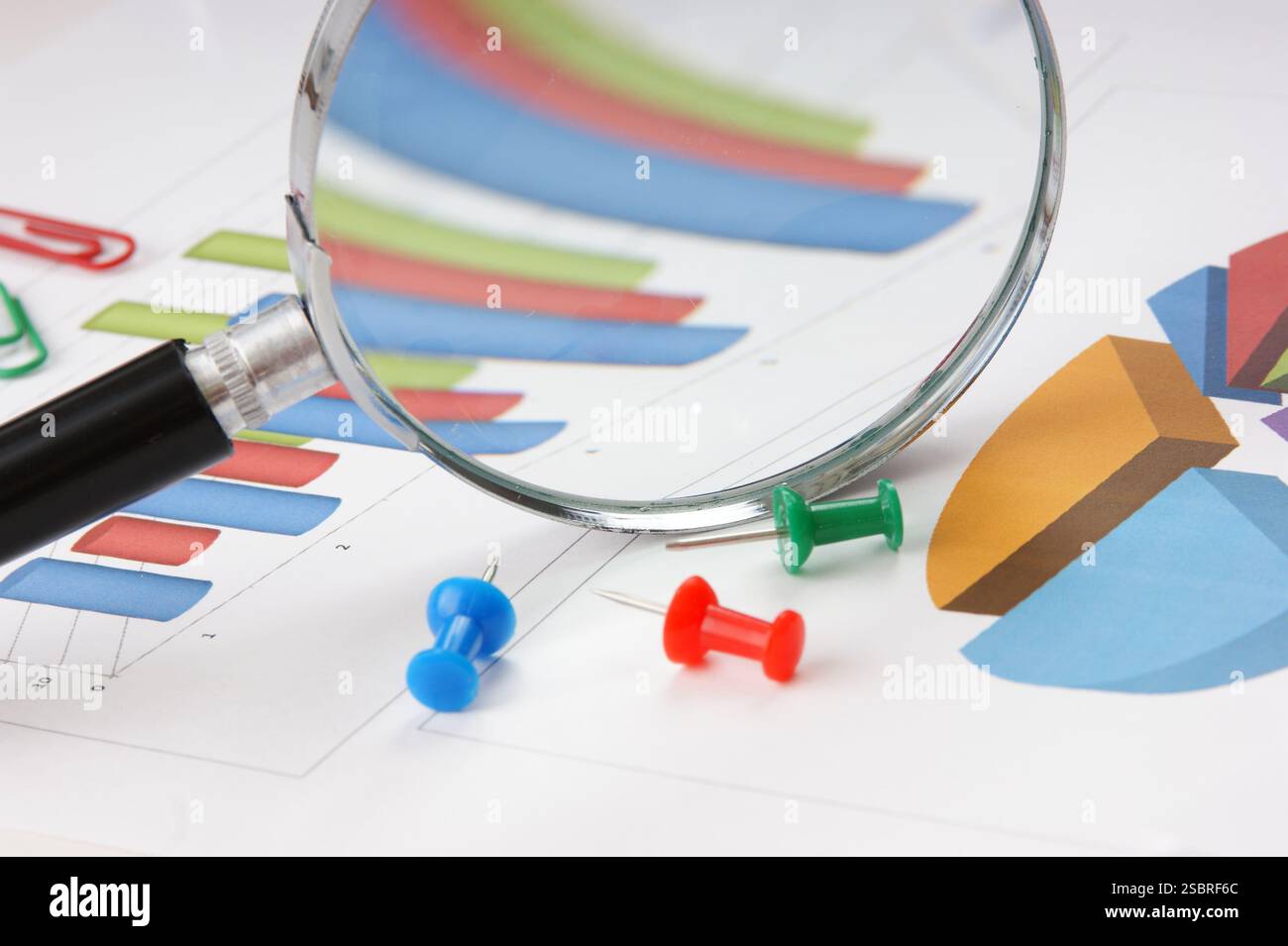 Graphs tables and documents laid on the table Stock Photo