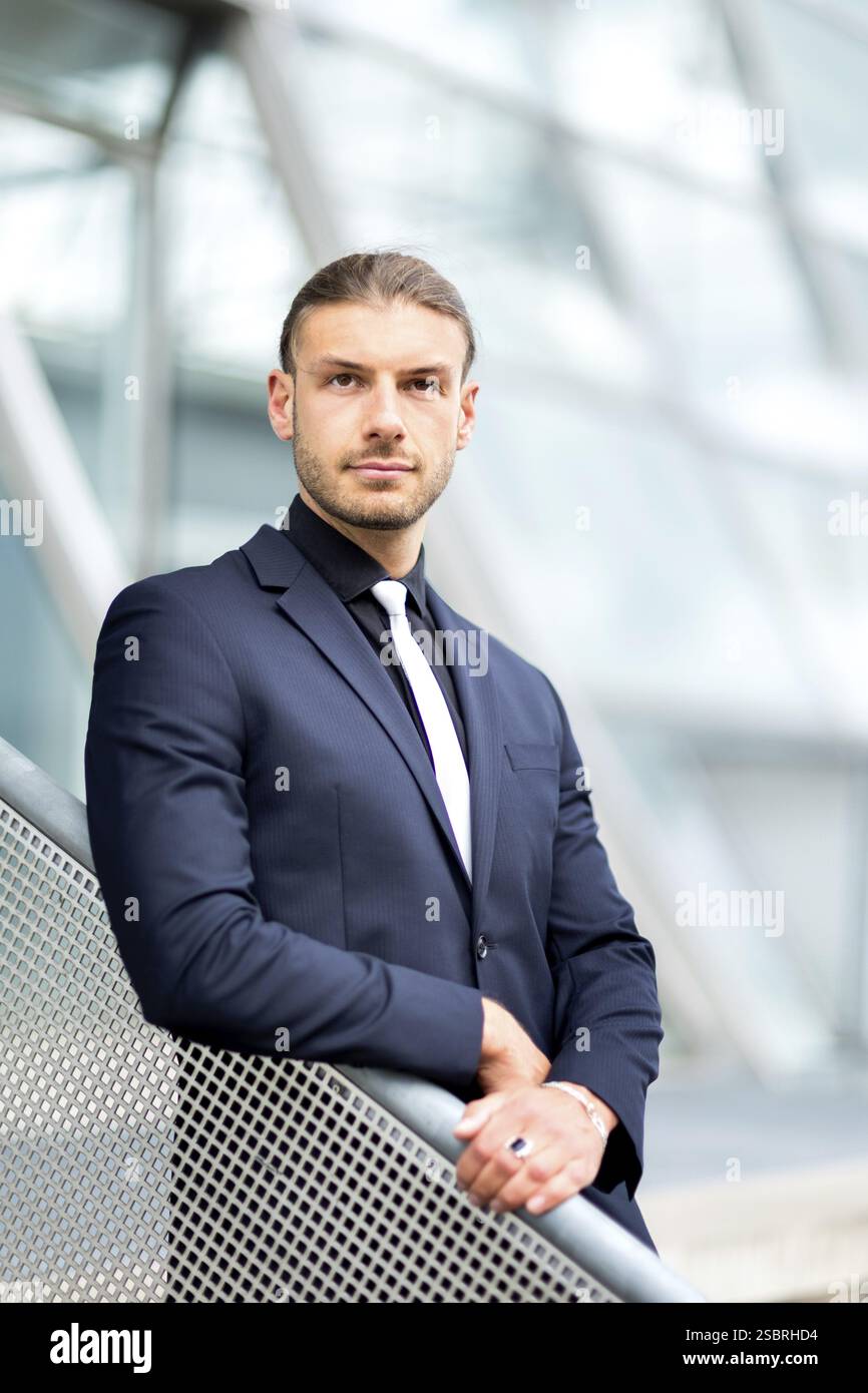 Handsome stylish young businessman posing portrait outdoor Stock Photo ...