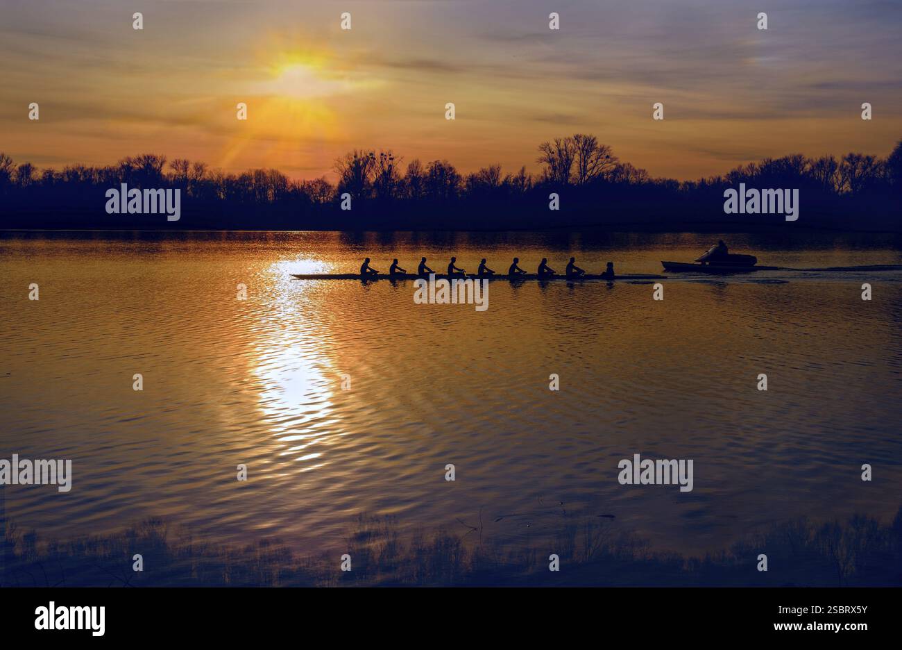 Silhouette of row boat against sunset over the lake Stock Photo - Alamy