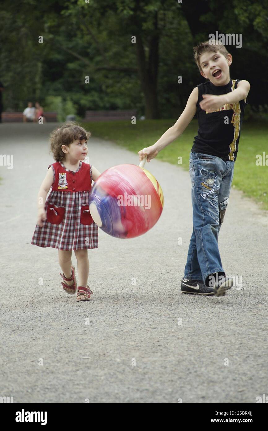 The brother and sister on walk in park Stock Photo - Alamy