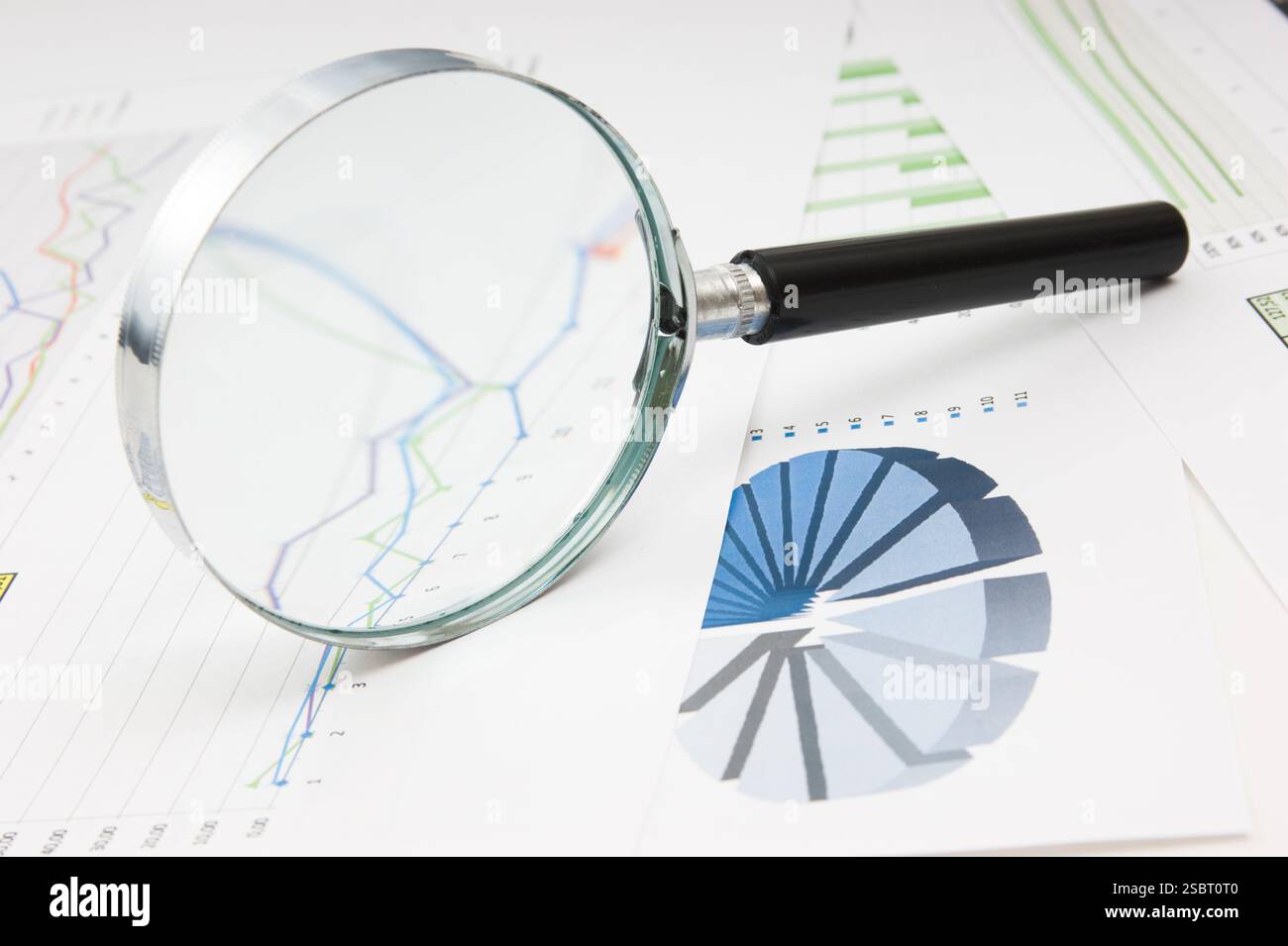 Graphs tables and documents laid on the table Stock Photo