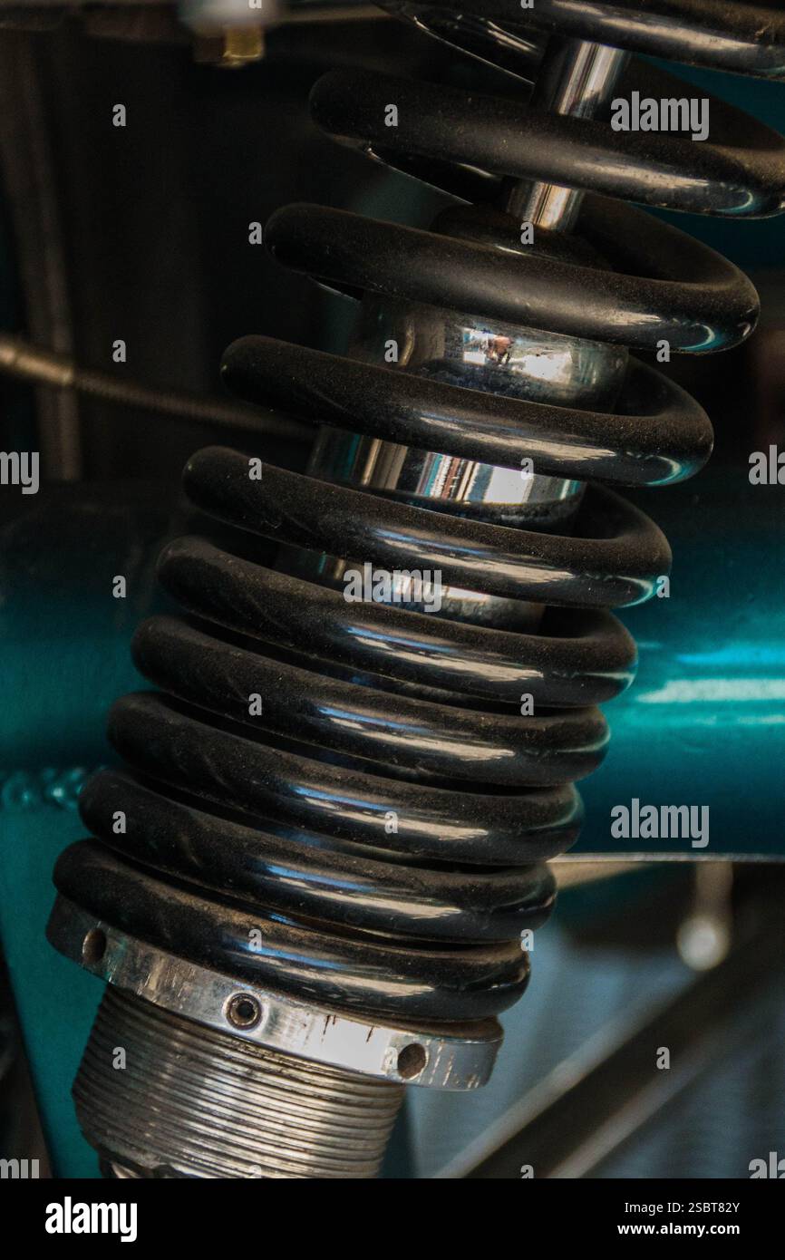A custom adjustable shock and coil spring on a classic car Stock Photo ...