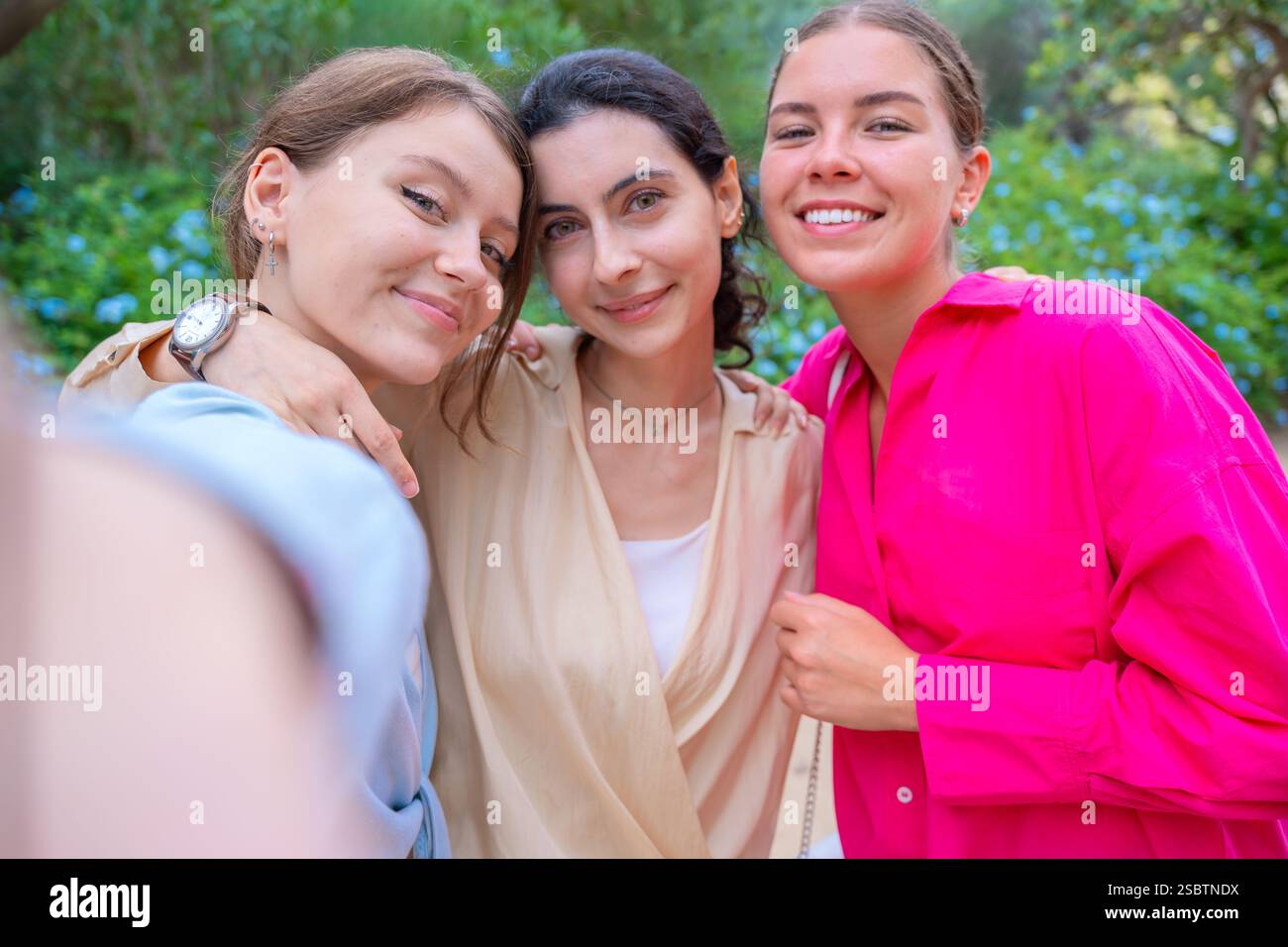 Three Happy Women Taking a Selfie in a Green Park Stock Photo - Alamy