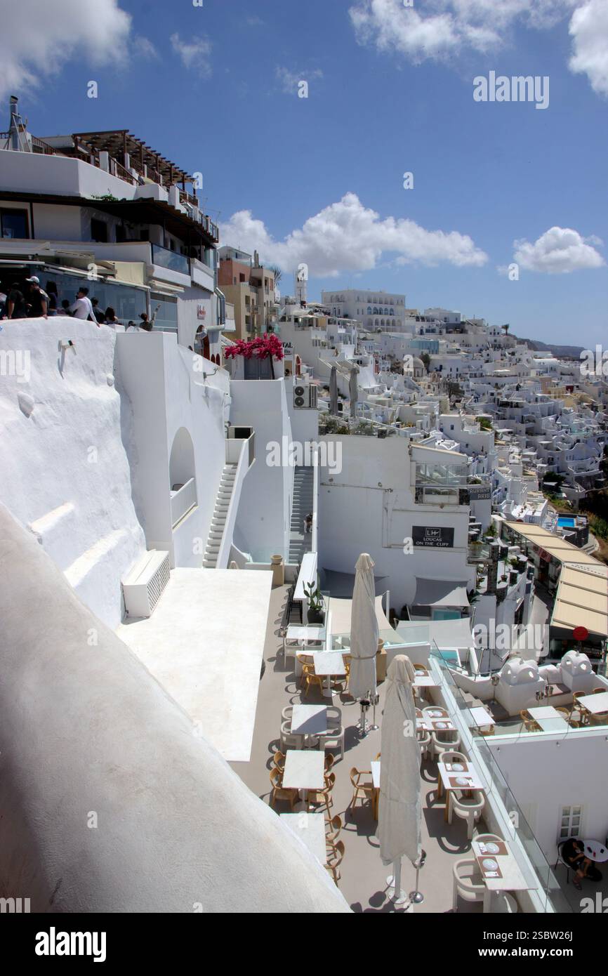 Fira, popular tourist destination on Santorini, has iconic white houses ...