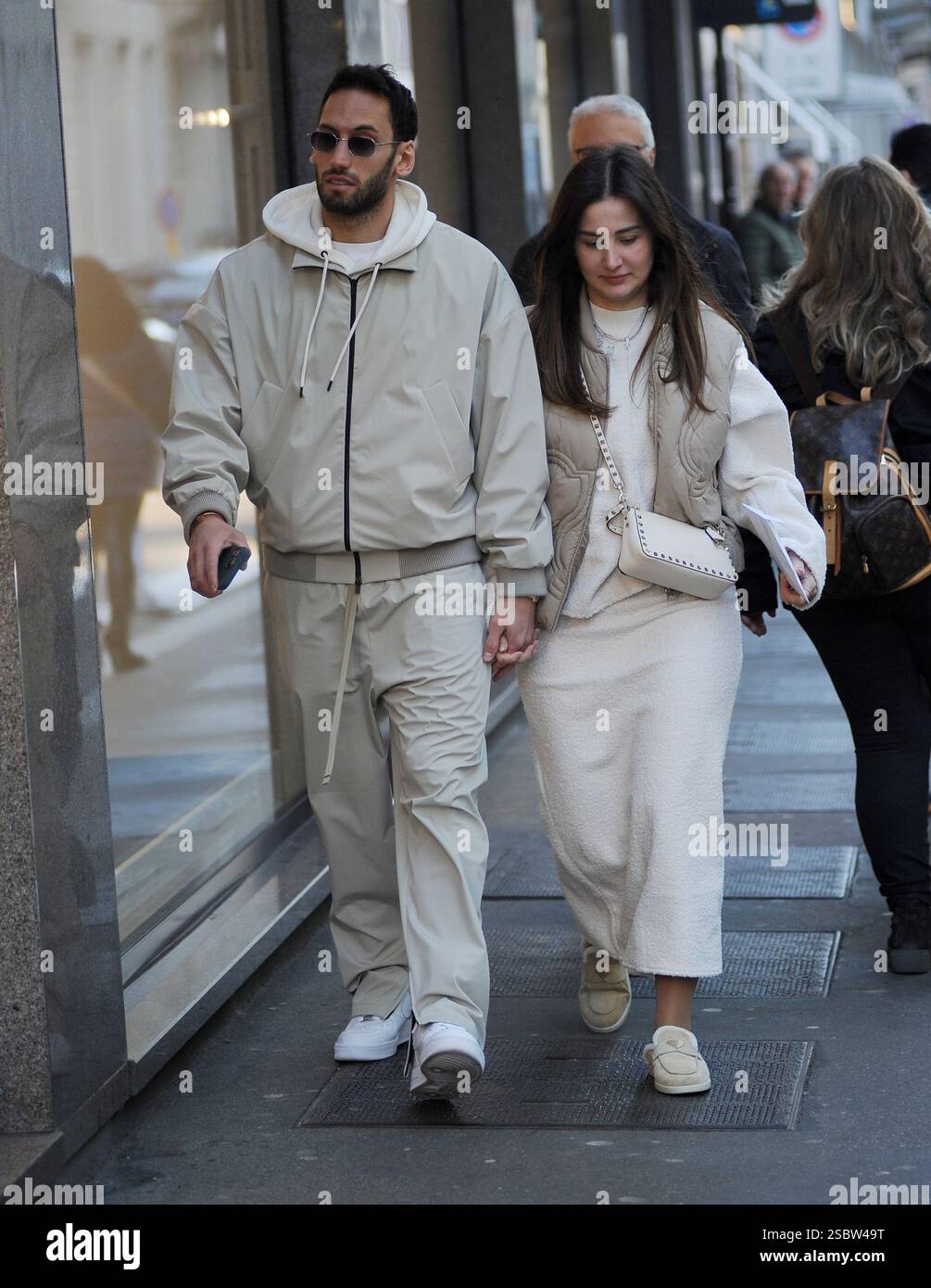 Milan, . 04th Feb, 2025. Milan, Hakan Calhanoglu, midfielder for Inter and the Turkish national team, strolls through the streets of the center with his wife Sinem, then the two enter a boutique to do some shopping. Credit: Independent Photo Agency/Alamy Live News Stock Photo