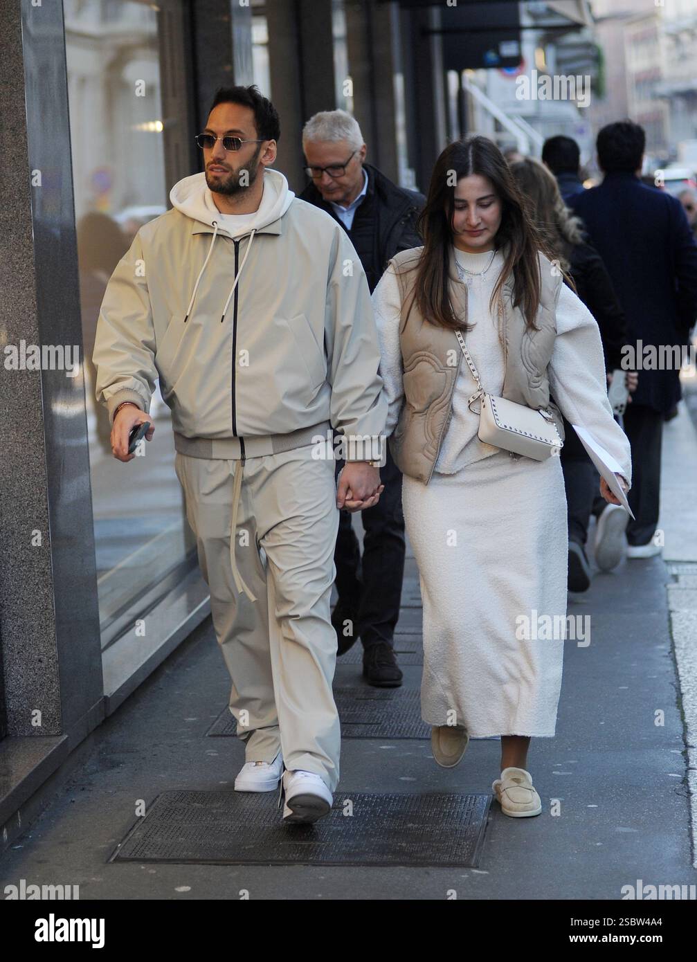 Milan, . 04th Feb, 2025. Milan, Hakan Calhanoglu, midfielder for Inter and the Turkish national team, strolls through the streets of the center with his wife Sinem, then the two enter a boutique to do some shopping. Credit: Independent Photo Agency/Alamy Live News Stock Photo