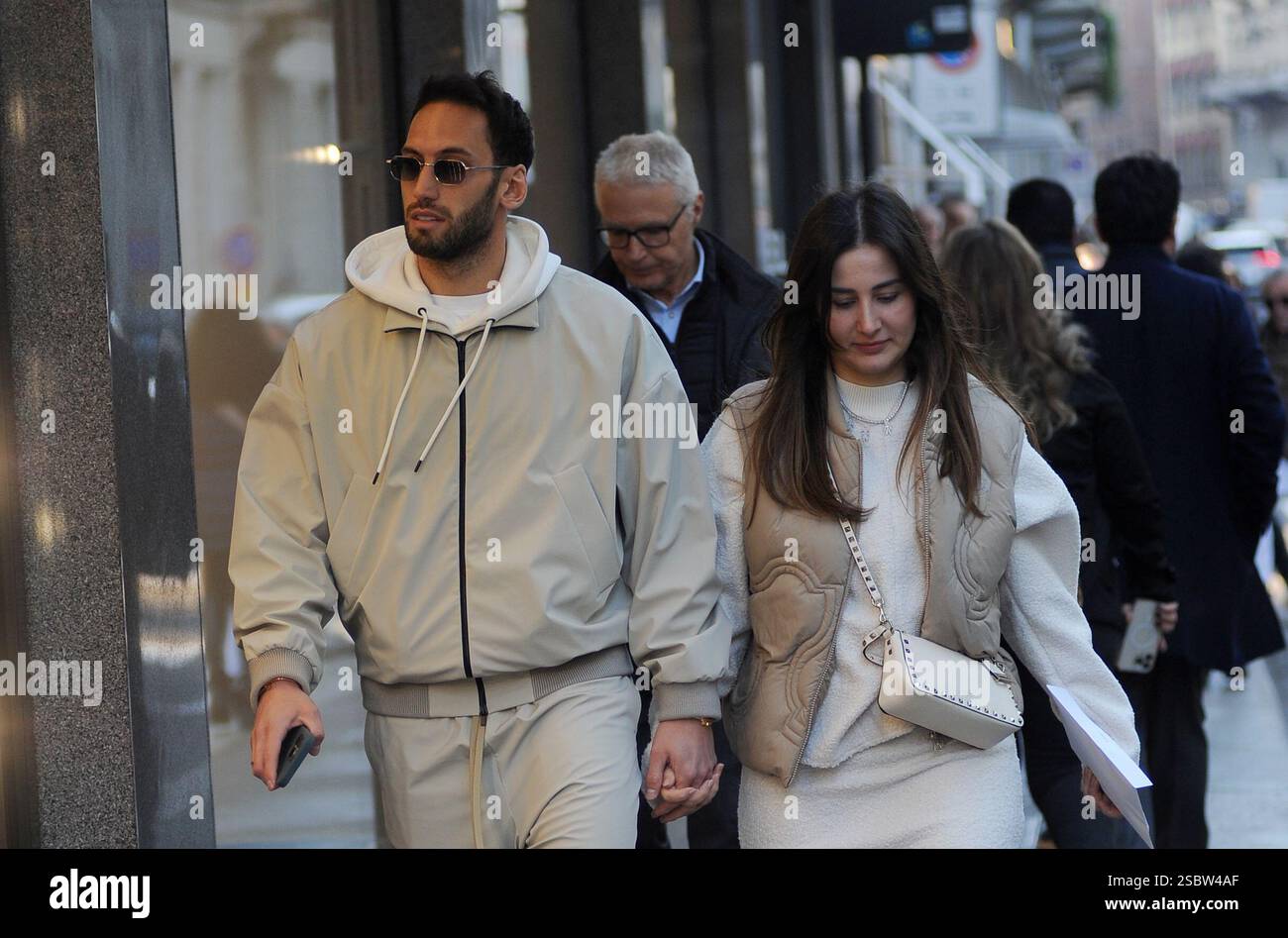 Milan, . 04th Feb, 2025. Milan, Hakan Calhanoglu, midfielder for Inter and the Turkish national team, strolls through the streets of the center with his wife Sinem, then the two enter a boutique to do some shopping. Credit: Independent Photo Agency/Alamy Live News Stock Photo