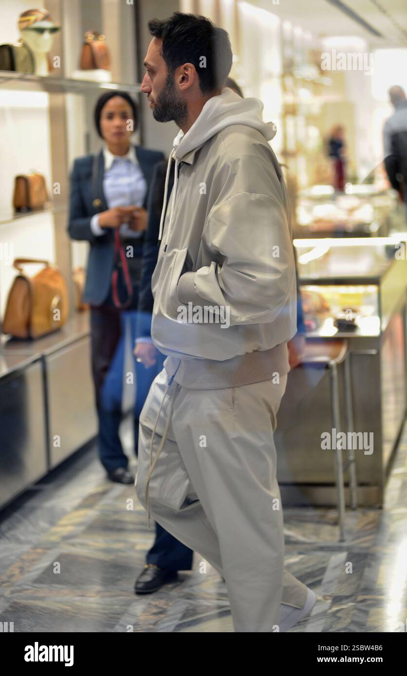 Milan, . 04th Feb, 2025. Milan, Hakan Calhanoglu, midfielder for Inter and the Turkish national team, strolls through the streets of the center with his wife Sinem, then the two enter a boutique to do some shopping. Credit: Independent Photo Agency/Alamy Live News Stock Photo