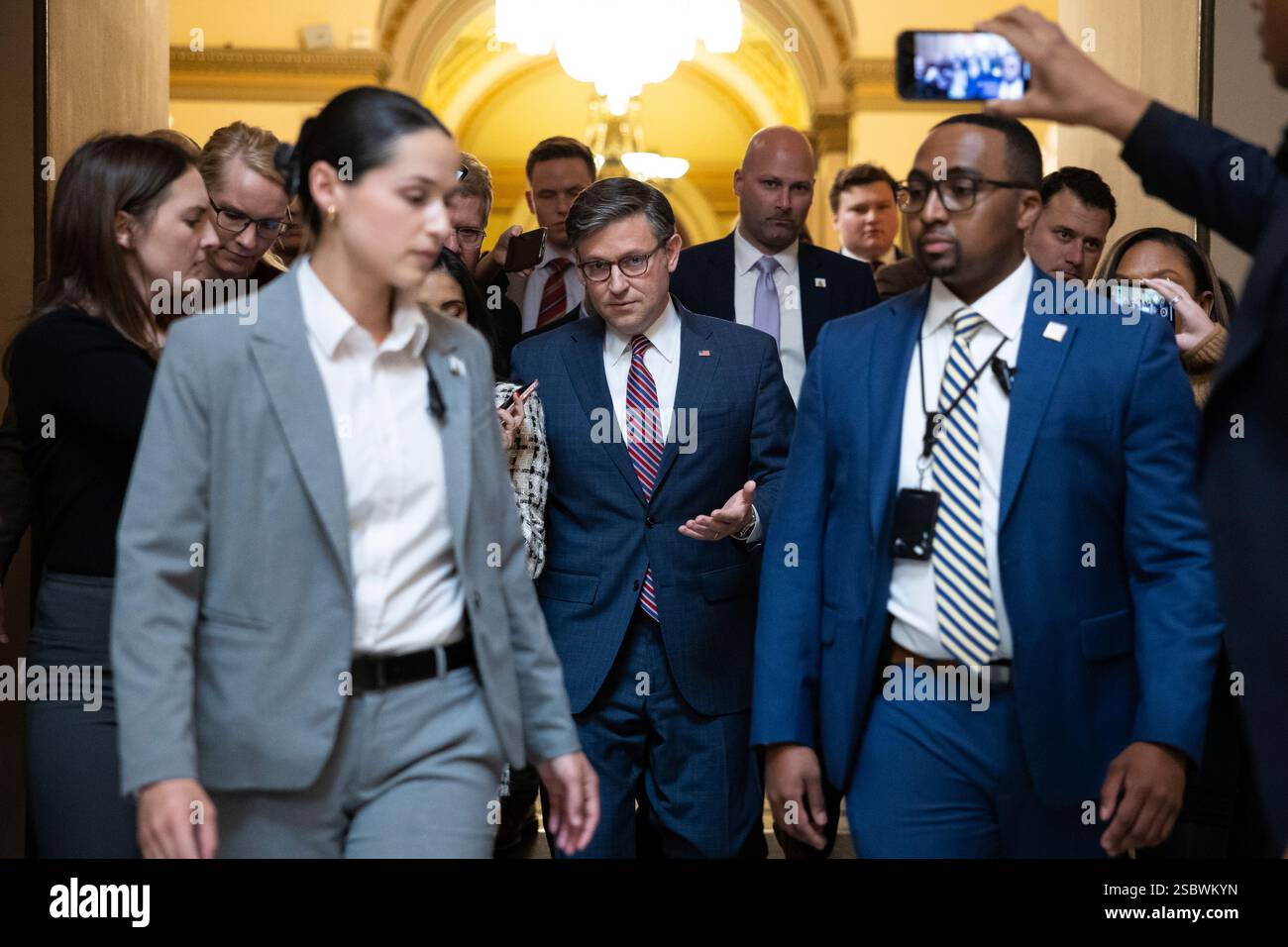 House Speaker Mike Johnson (R-La.) speaks with reporters as he walks to ...