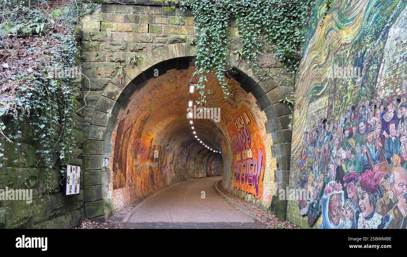 Colinton Tunnel art installation. Graffiti designs in an old railway tunnel.  Edinburgh, Scotland. Old railway line track public right of way cycle pa - Smartphone Captured Stock Image