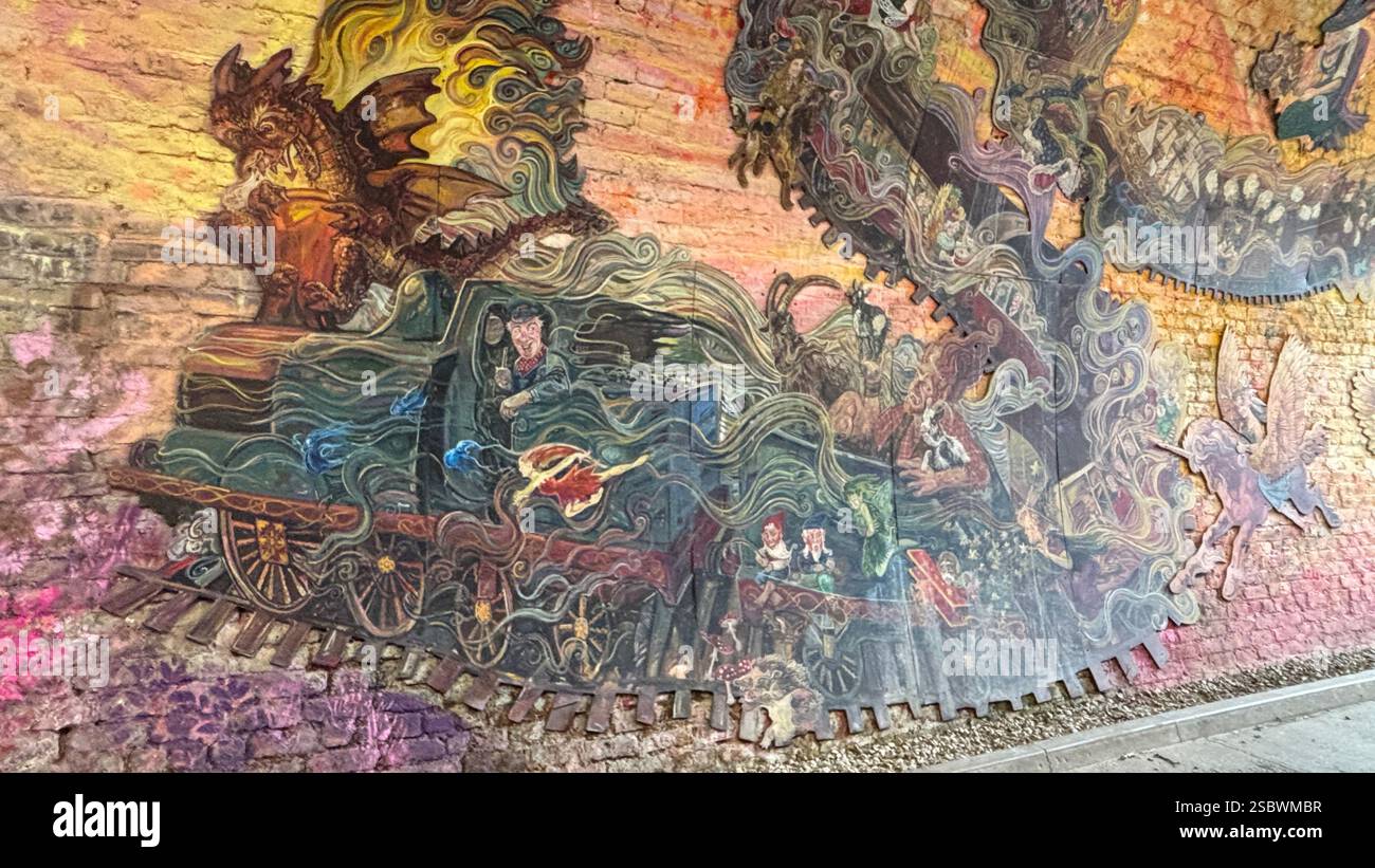 Colinton Tunnel art installation. Graffiti designs in an old railway tunnel.  Edinburgh, Scotland. Old railway line track public right of way cycle pa - Smartphone Captured Stock Image