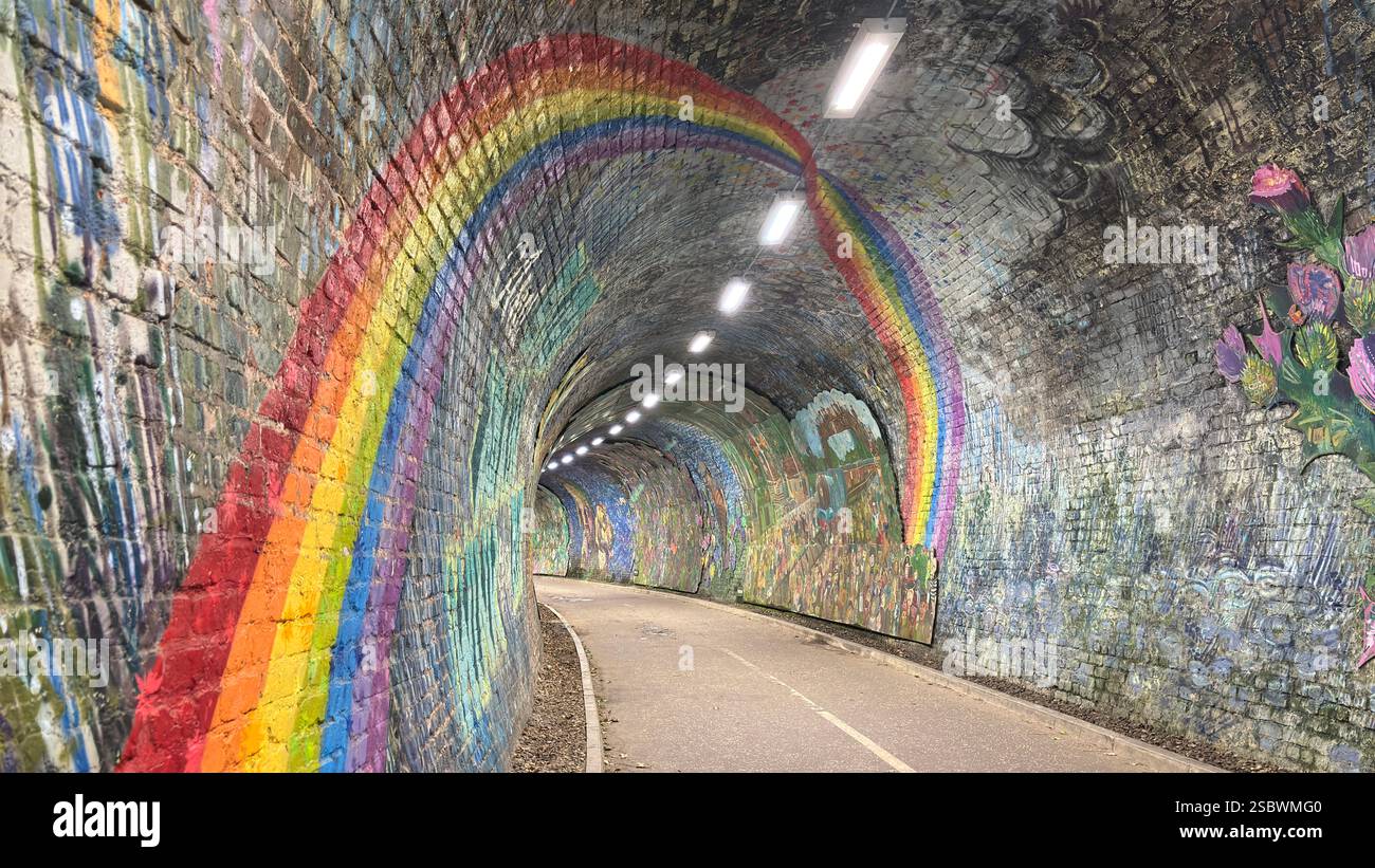 Colinton Tunnel art installation. Graffiti designs in an old railway tunnel.  Edinburgh, Scotland. Old railway line track public right of way cycle pa - Smartphone Captured Stock Image