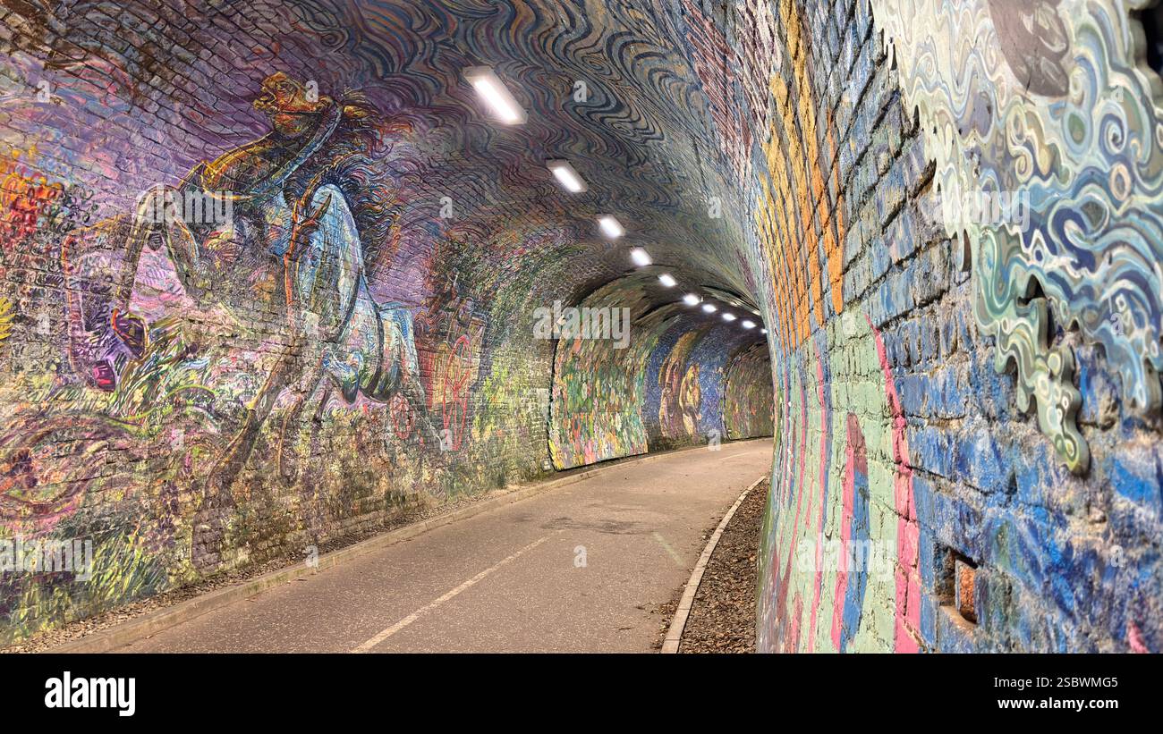 Colinton Tunnel art installation. Graffiti designs in an old railway tunnel.  Edinburgh, Scotland. Old railway line track public right of way cycle pa - Smartphone Captured Stock Image