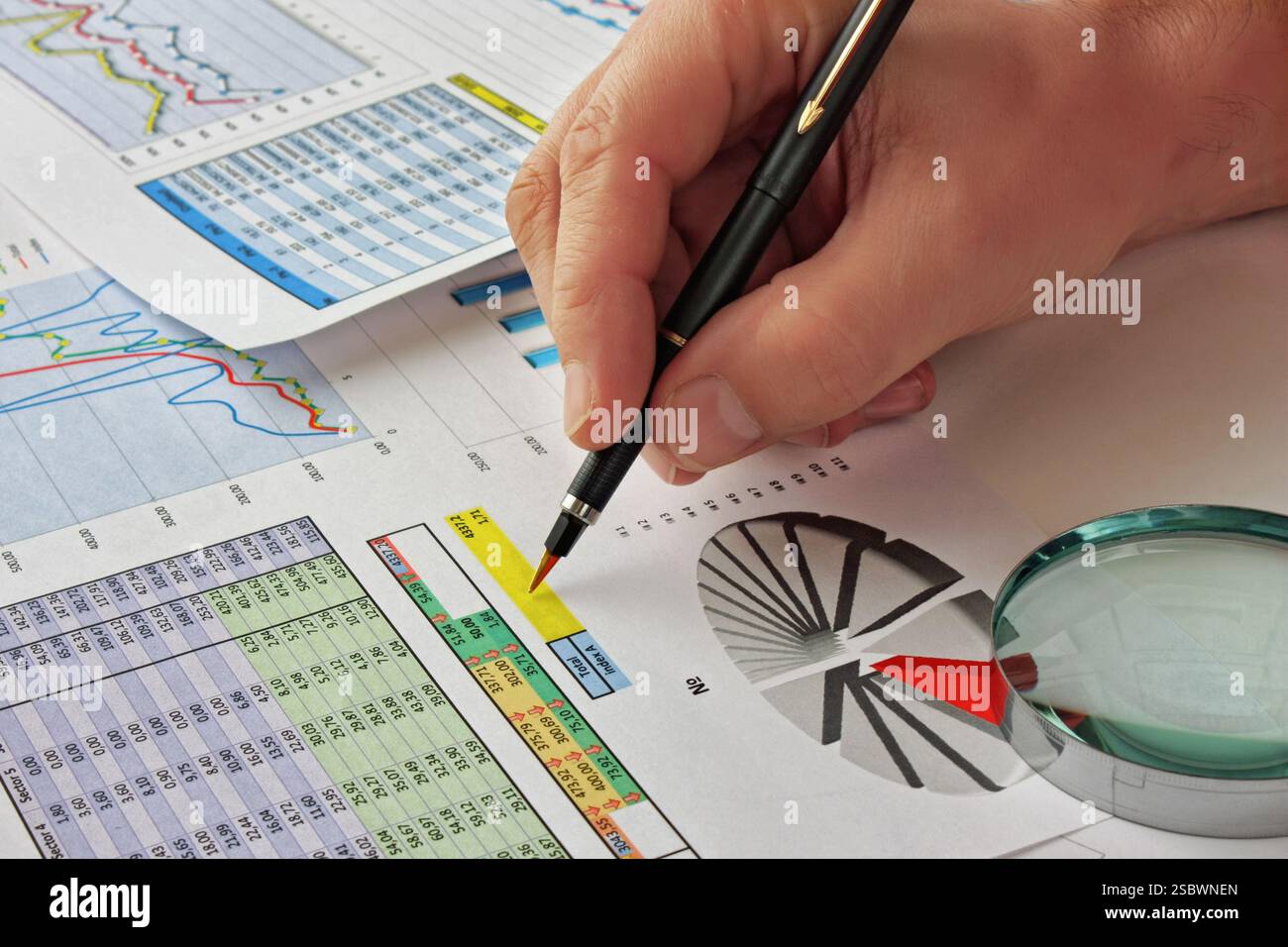 Graphs tables and documents laid on the table Stock Photo
