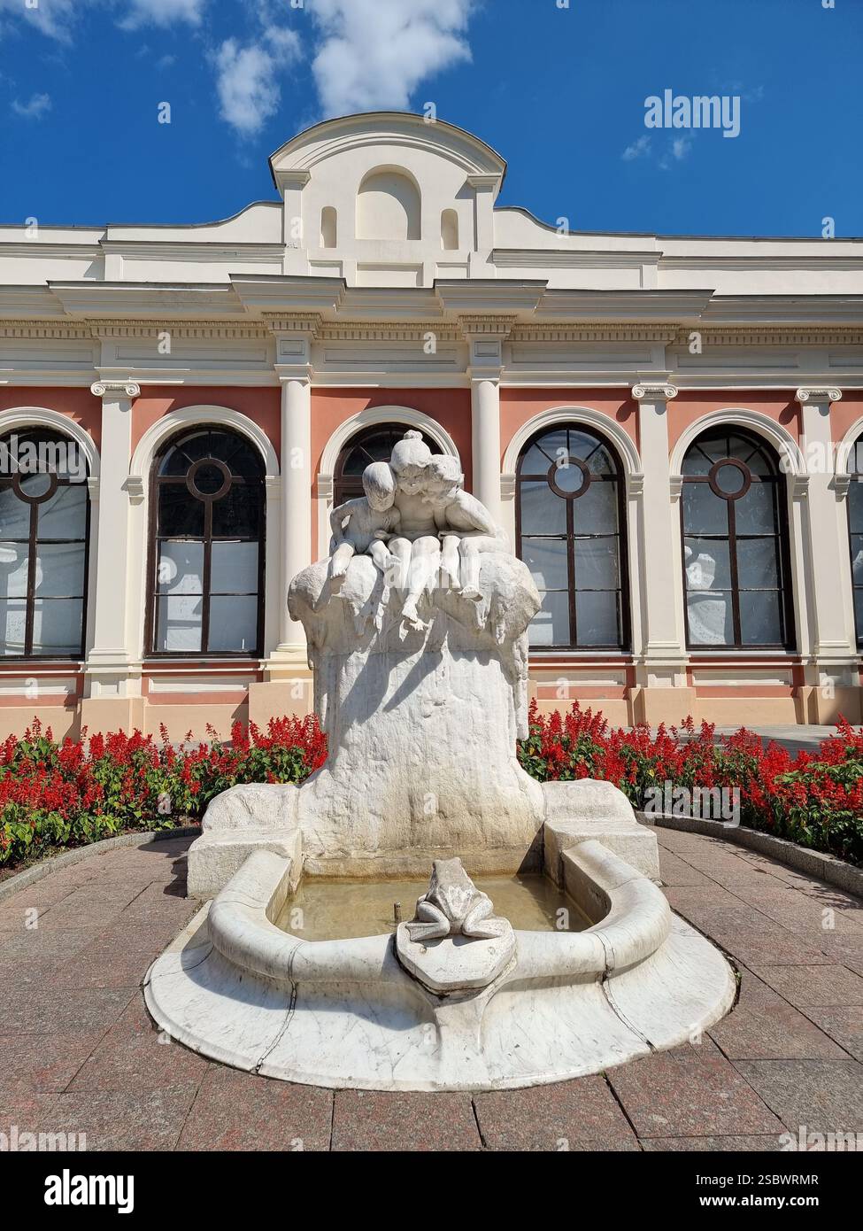 Frontal view of sculpture-fountain "Youth", a.k.a. Children and the Frog or Narcissus in front of the opera of Odesa / Odessa, Ukraine; daytime - Smartphone Captured Stock Image