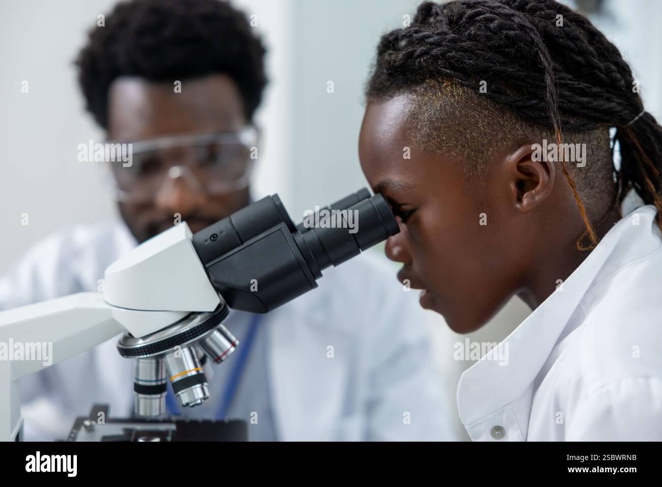 Schoolgirl in lab coat hi-res stock photography and images - Alamy