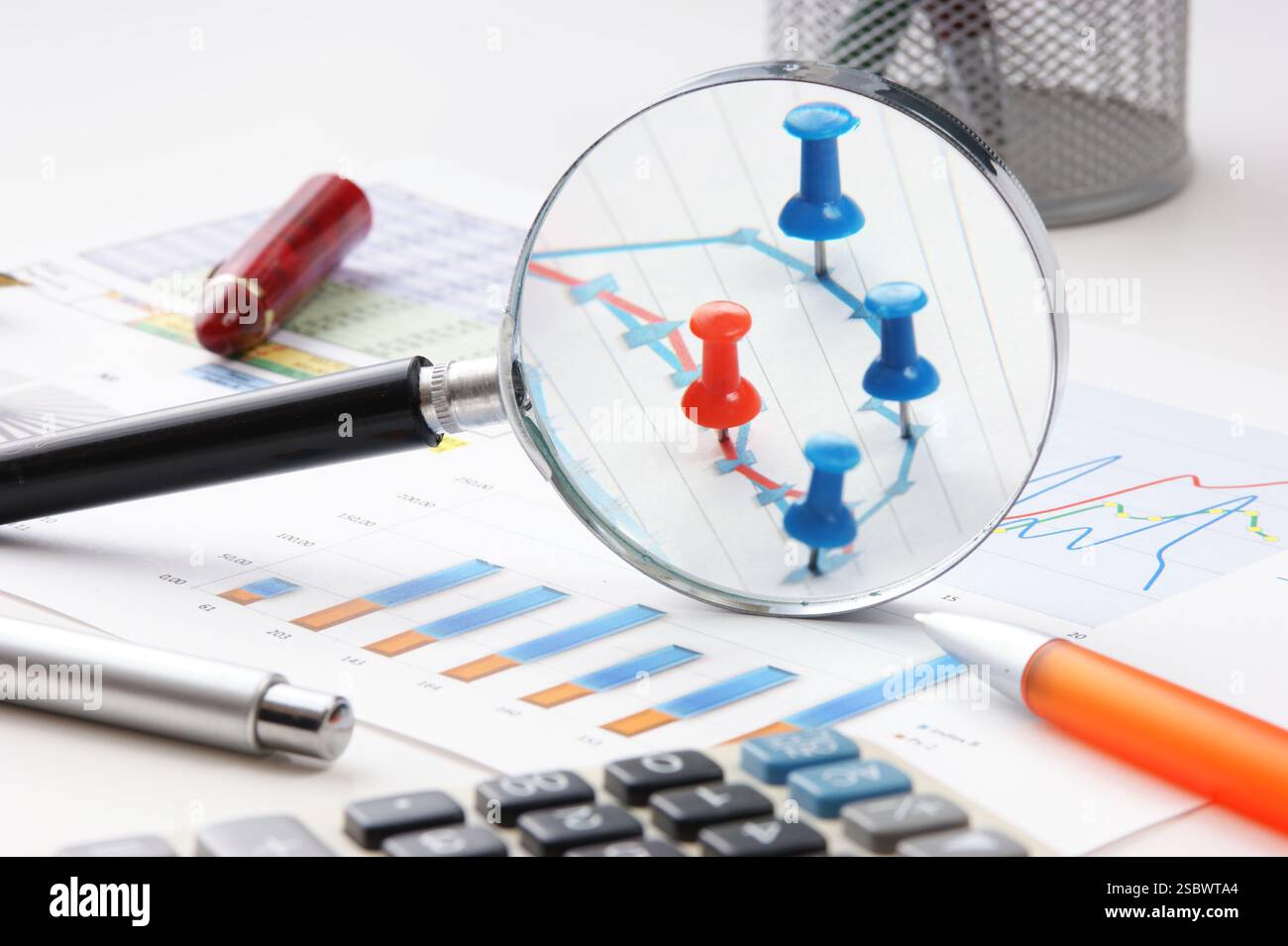Graphs tables and documents laid on the table Stock Photo