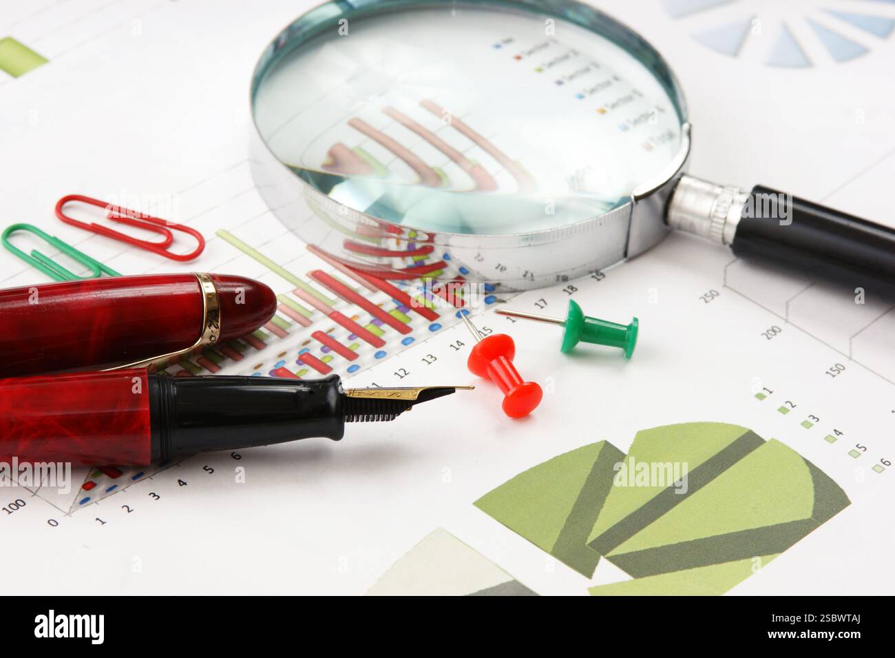 Graphs tables and documents laid on the table Stock Photo