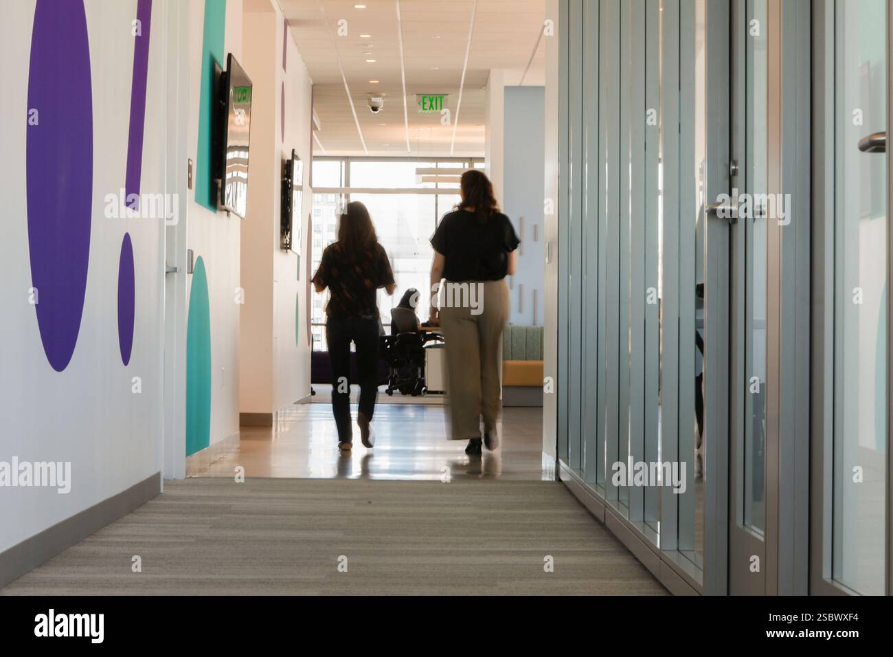 IMAGE DISTRIBUTED FOR YAHOO - Two Yahoo employees walk together past ...