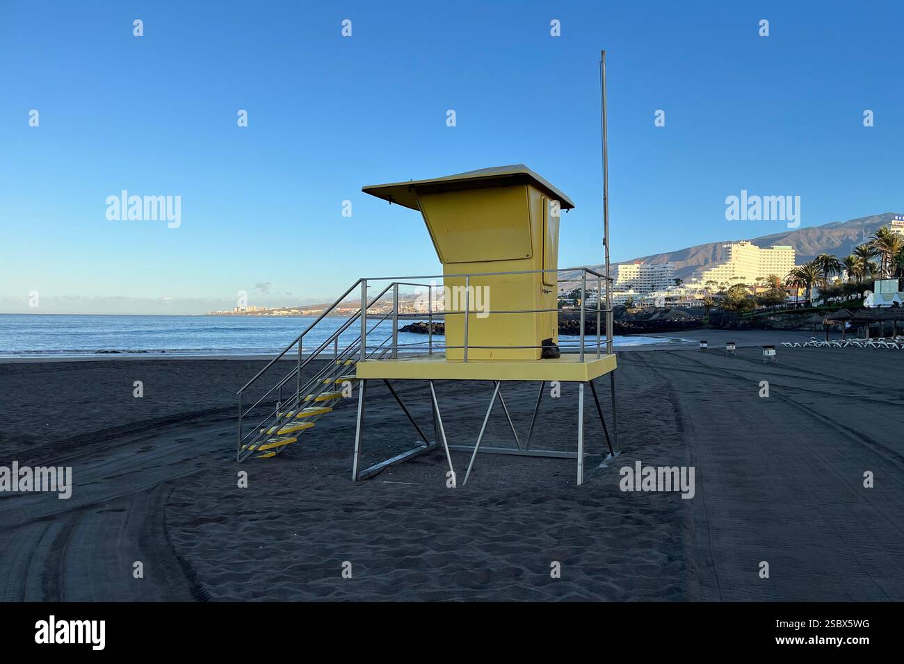 Yellow Lifeguard Station on Troya Beach where Costa Adeje and Playa de las Américas meet. Tenerife, Canary Islands, Spain. 14th January 2025. - Smartphone Captured Stock Image