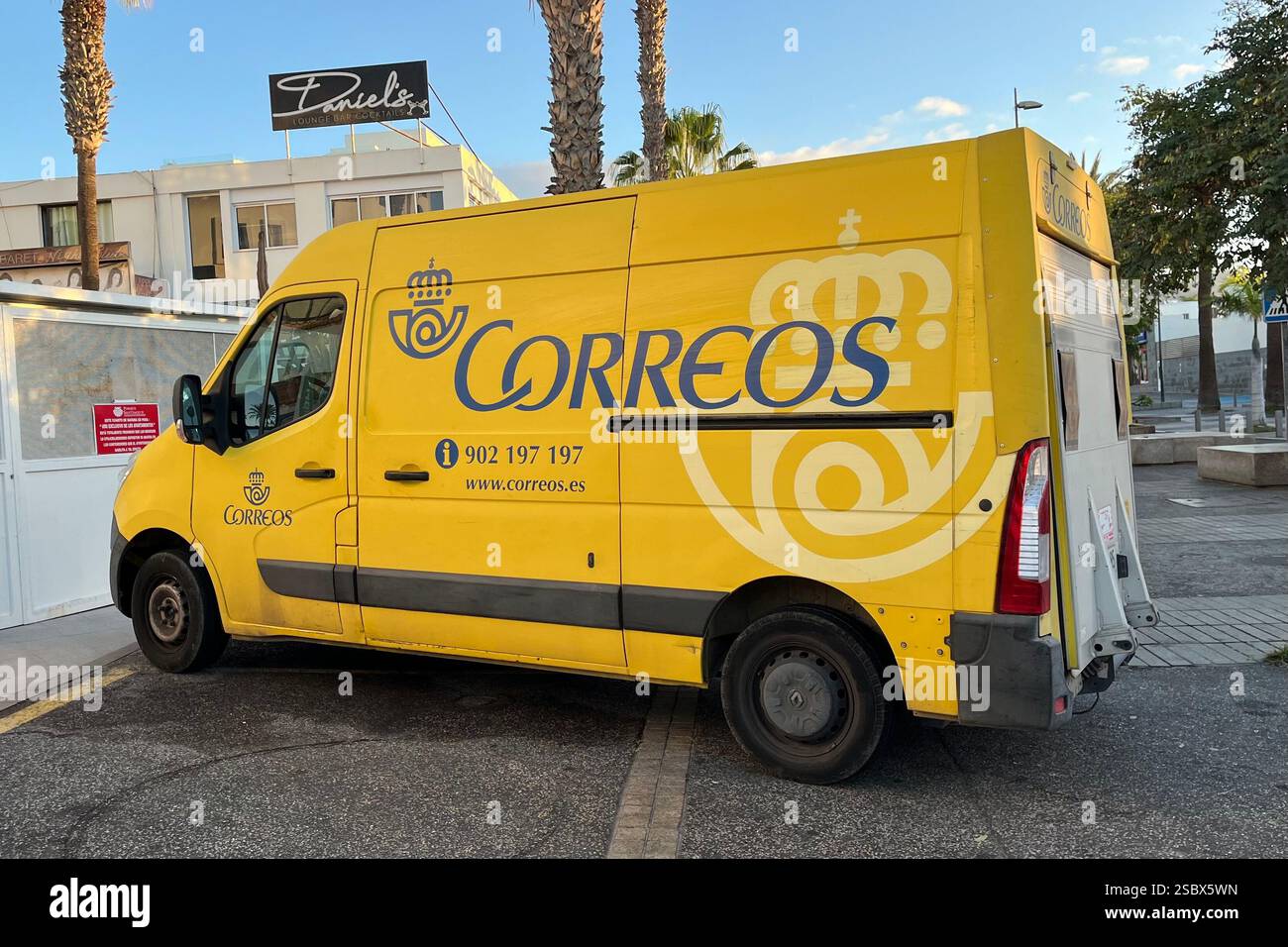 Yellow Correos Mail Van parked in Playa de las Américas. Arona, Tenerife. Canary Islands, Spain. 15th January 2025. - Smartphone Captured Stock Image