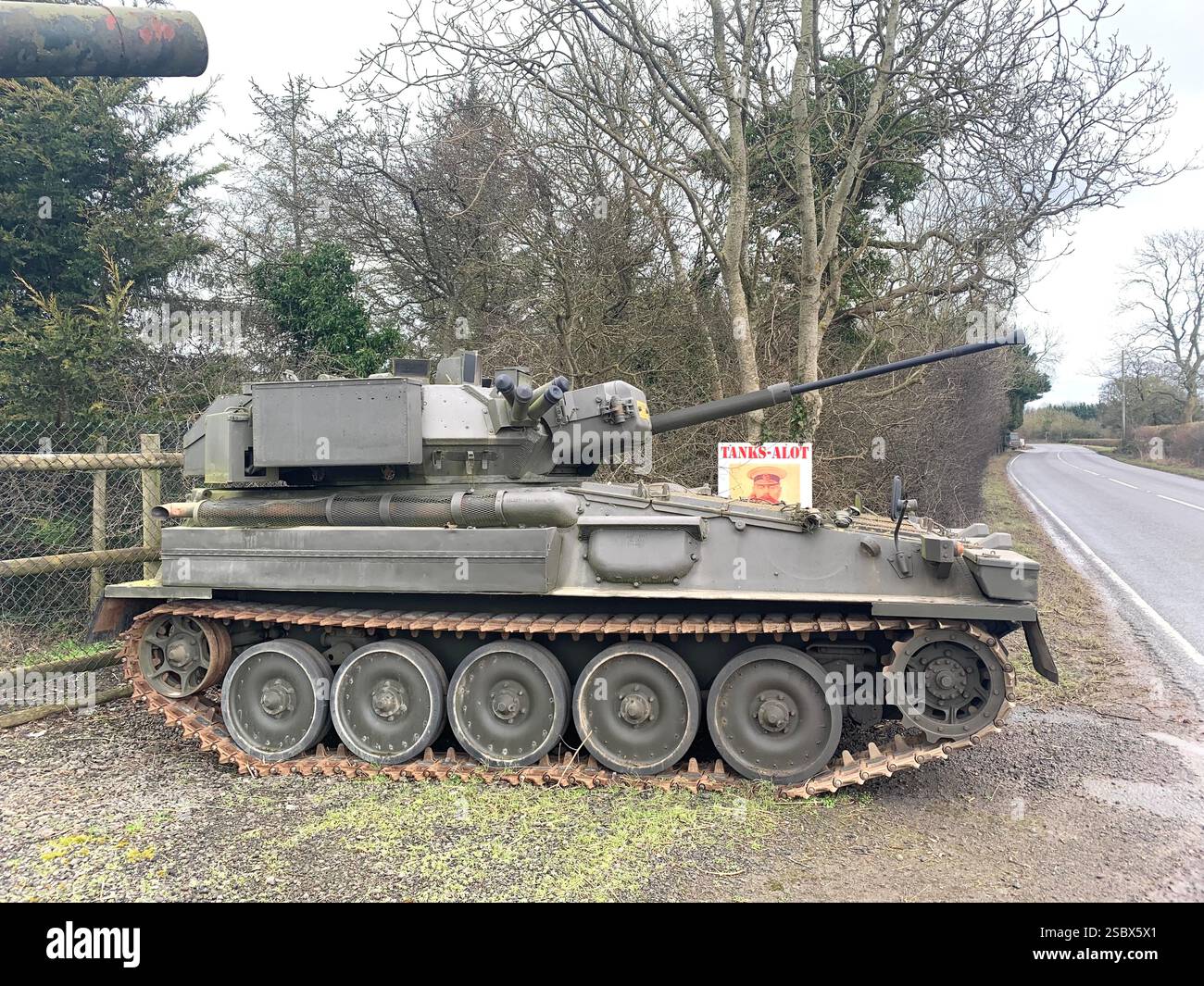 Tank Tanks Banbury Lane Northamptonshire army military war destroy painted green gun guns wars war battle track tracks outside metal armoured plate - Smartphone Captured Stock Image