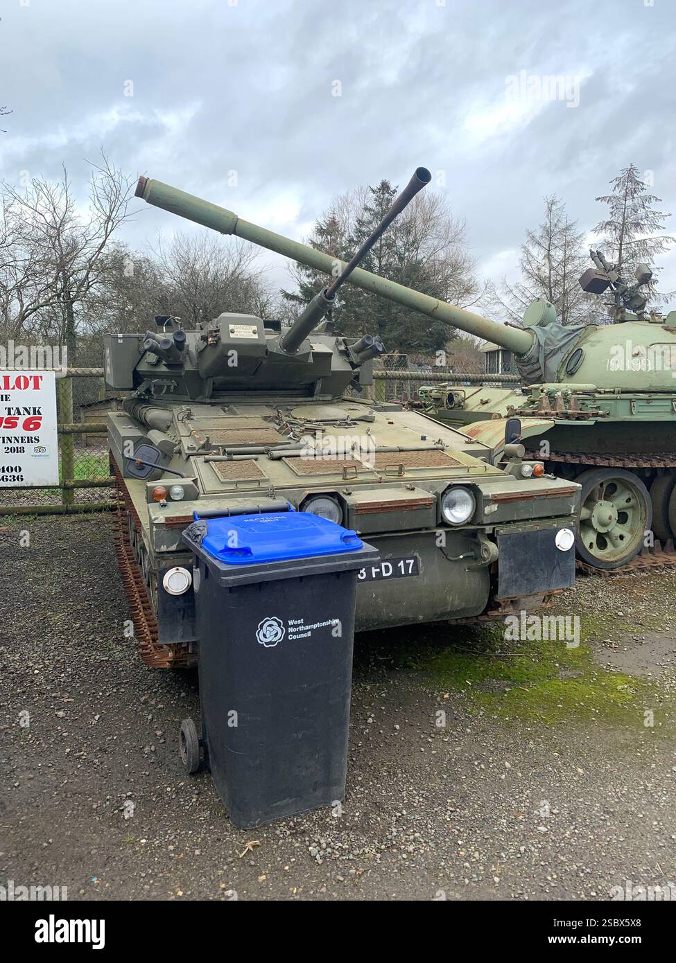 Tank Tanks Banbury Lane Northamptonshire army military war destroy painted green gun guns wars war battle track tracks outside metal armoured plate - Smartphone Captured Stock Image