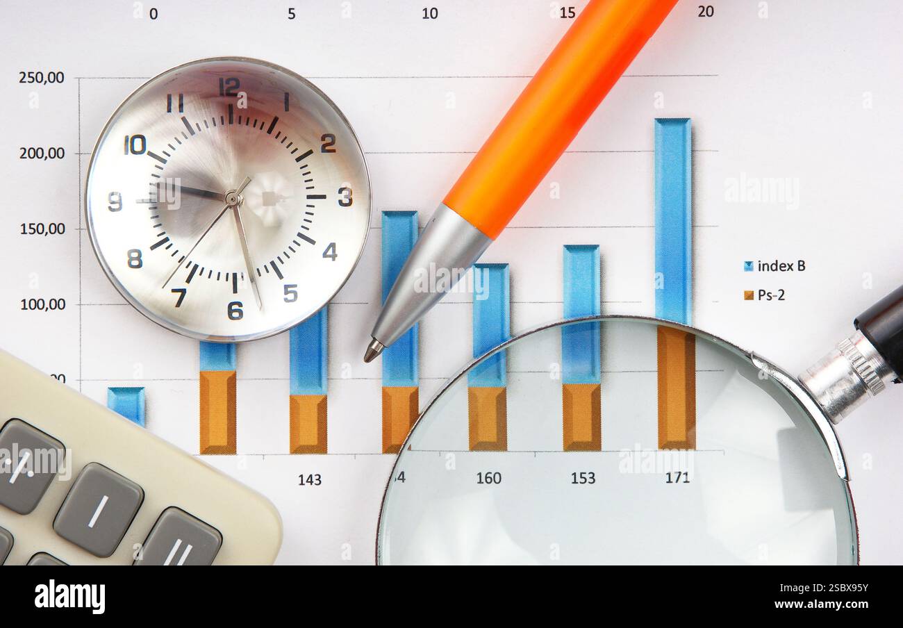 Graphs tables and documents laid on the table Stock Photo