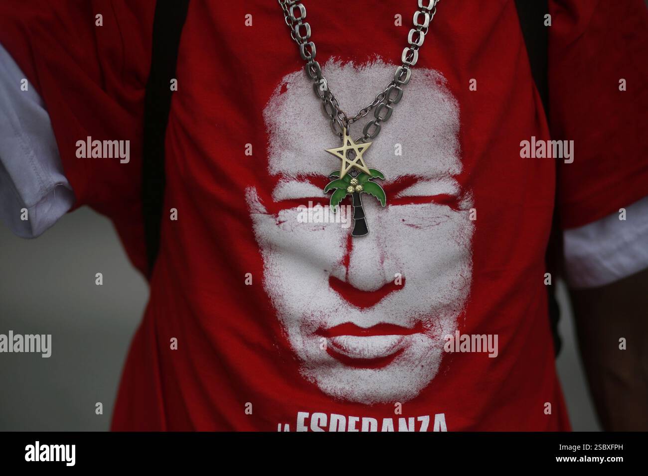 A government supporter wears a T-shirt depicting late Venezuelan