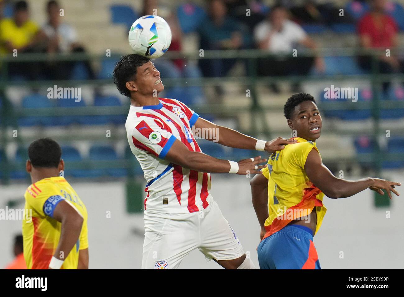 Keimer Paraguay's Axel Balbuena, left, heads the ball against Colombia's ...