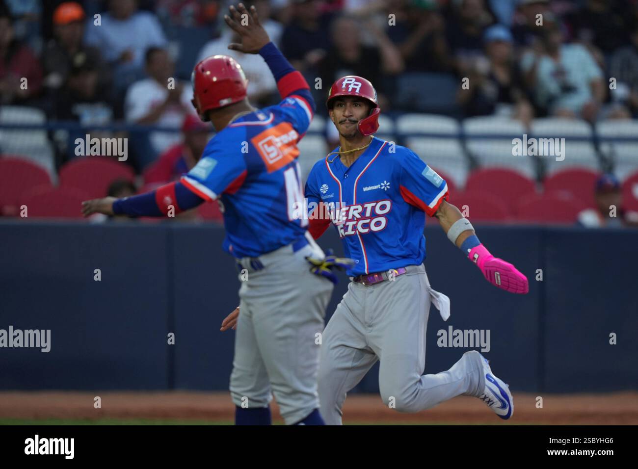 Puerto Rico's Robbie Merced, right, celebrates after scoring against
