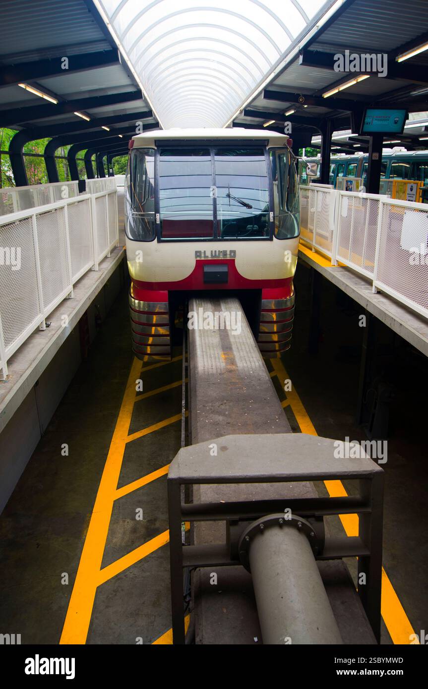 A monorail train at the platform in the station at the Seattle Center to the north of downtown Seattle, Washington, USA. The monorail runs between the downtown area and the Seattle Center, which is the site of the 1962 World's Fair and includes the iconic Space Needle. Stock Photo