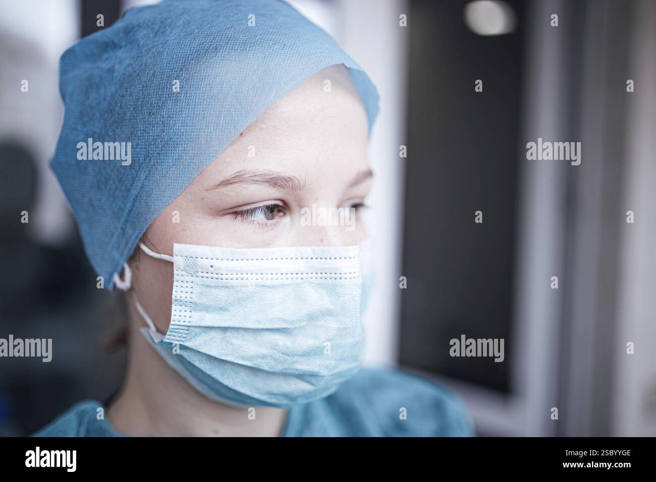 Woman in blue scrubs covers hi-res stock photography and images - Alamy