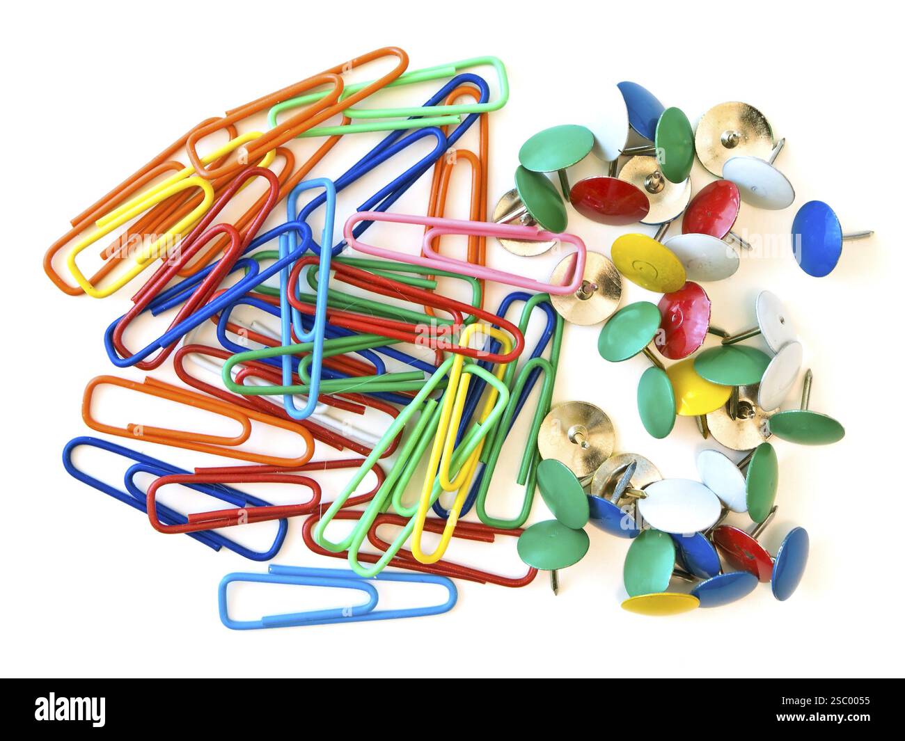 Some multicolored pins and paper clips at the white table Stock Photo