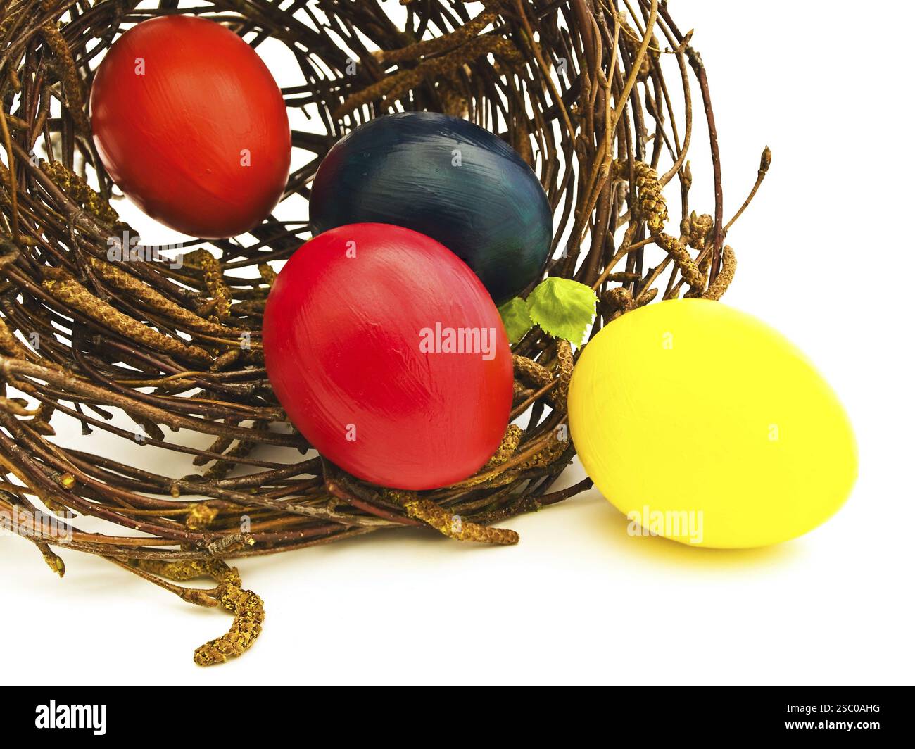 Easter Nest With Multicolored Eggs Against White Stock Photo
